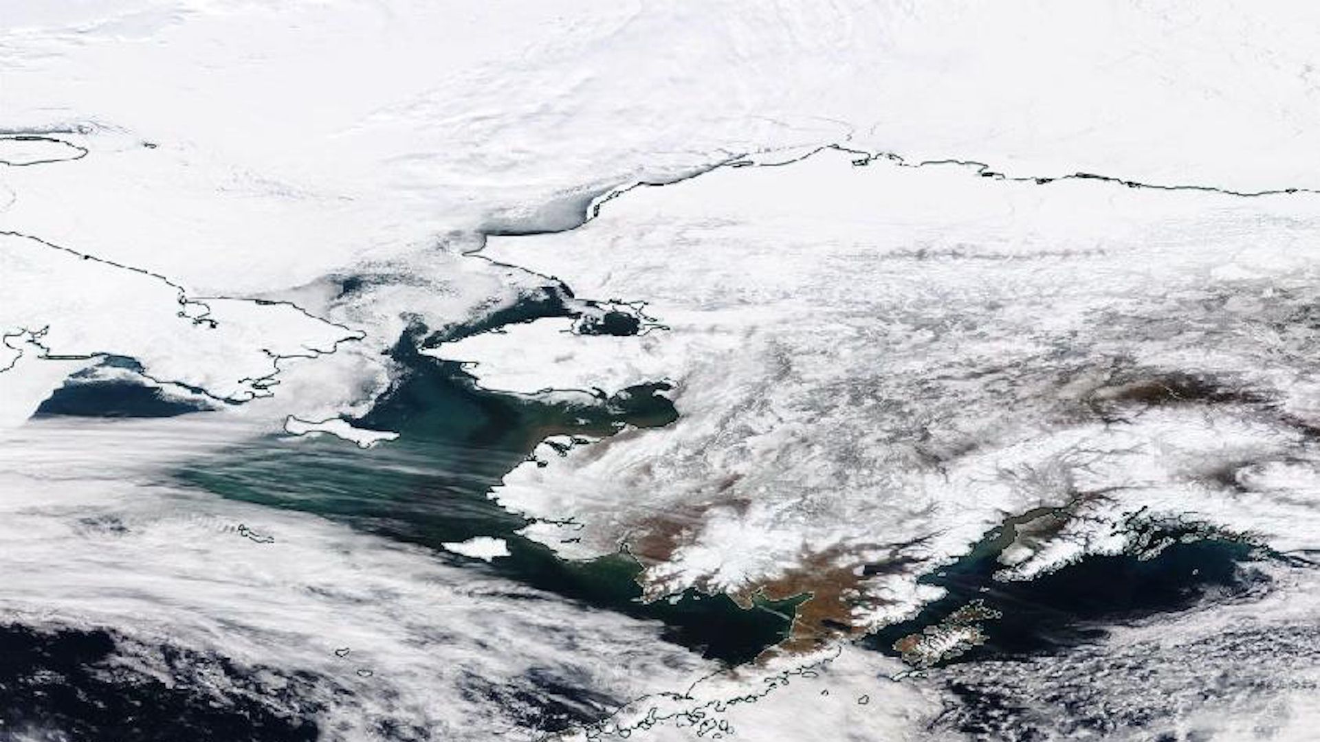 Sea ice seen via satellite has withdrawn from the Bering Sea between Alaska and Russia.