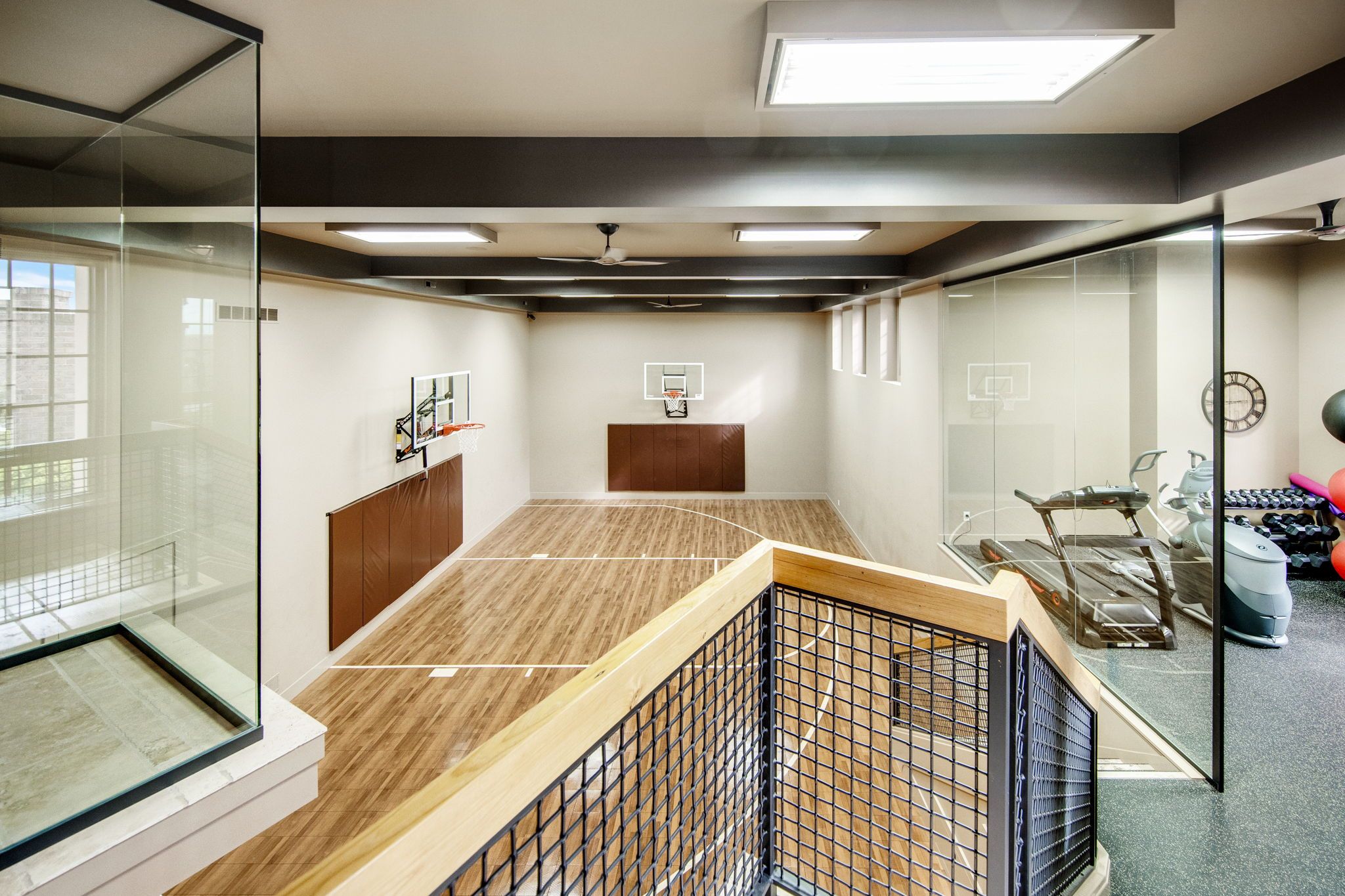 A basketball court with glass walls. 