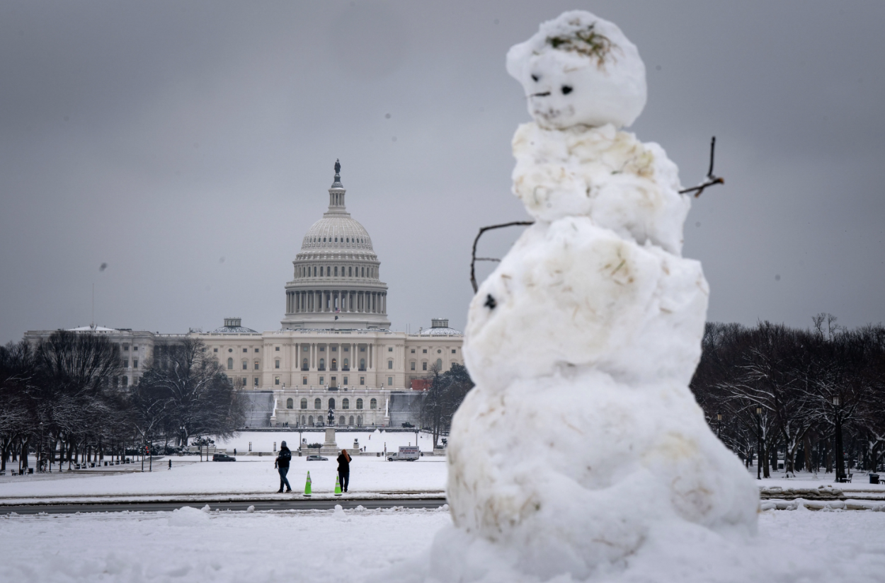 The scene at the U.S. Capitol on Jan. 16, as the biggest snowfall in more than two years blankets the Washington Metropolitan area — shutting down schools and halting flights across the region. The snow forced the House of Representatives to postpone voting on a stopgap spending bill in D.C.