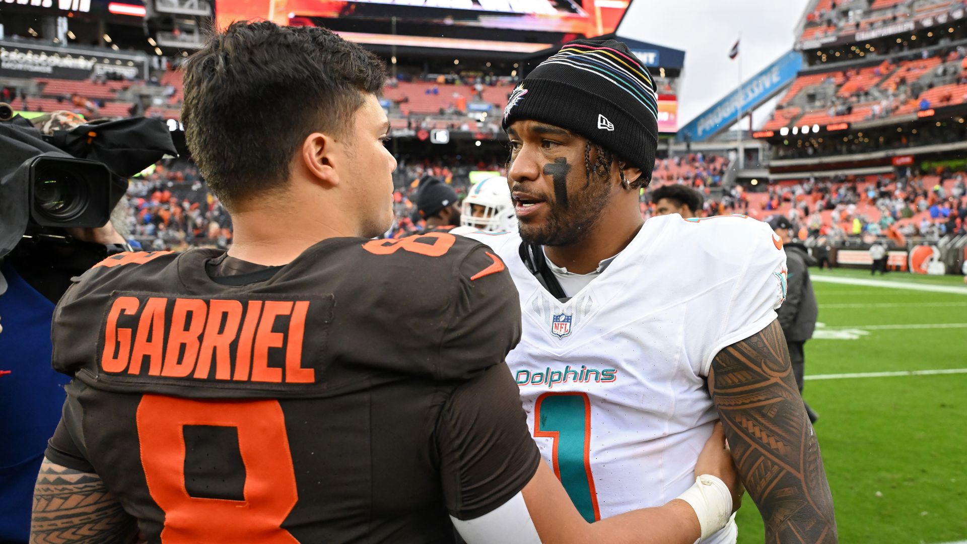 Dillon Gabriel #8 of the Cleveland Browns and Tua Tagovailoa #1 of the Miami Dolphins meet on the field after their game.