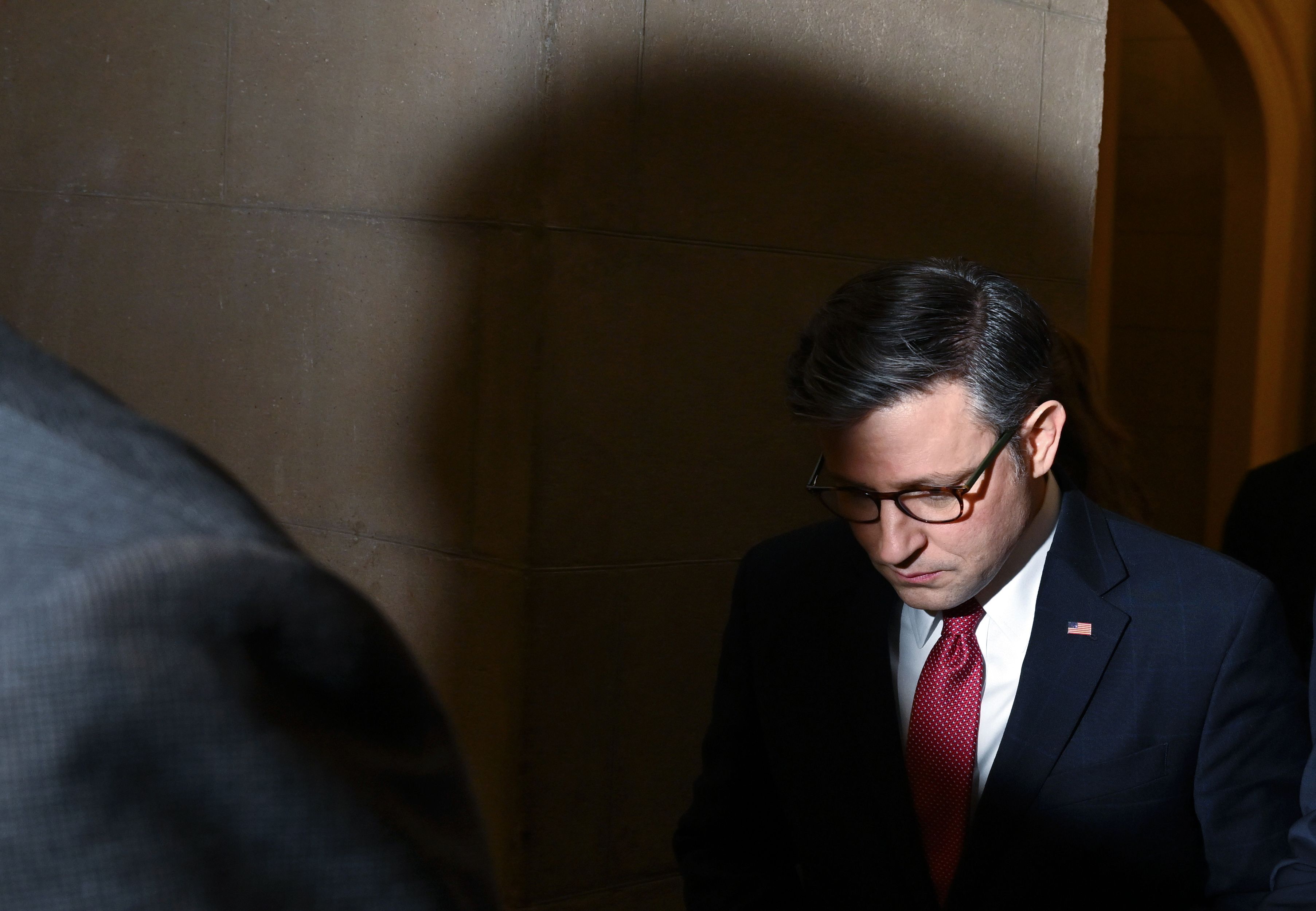 Speaker of the House Mike Johnson walks to the House floor at the United States Capitol on Thursday.
