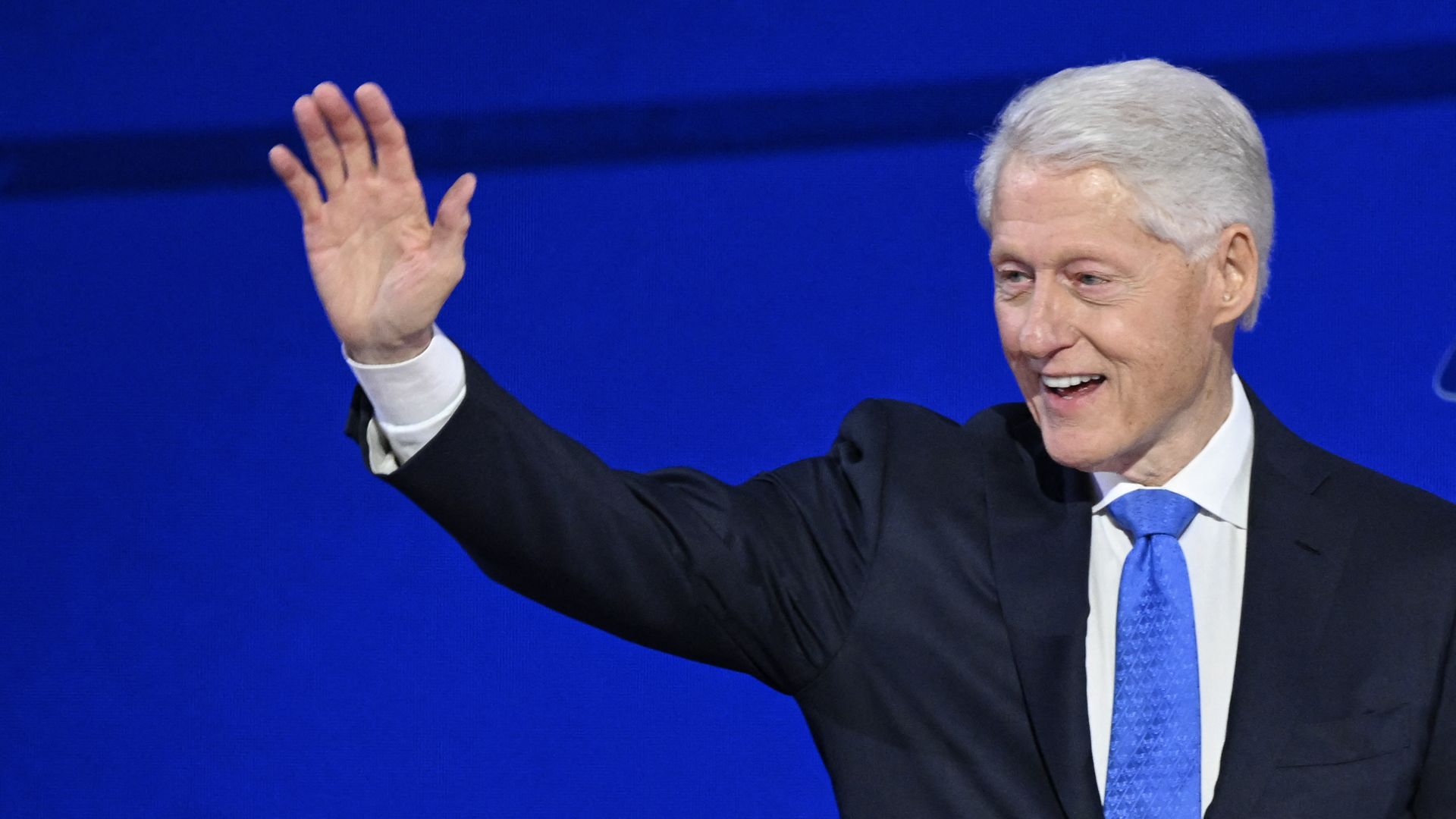 Former US President Bill Clinton arrives onstage to speak on the third day of the Democratic National Convention (DNC) at the United Center in Chicago, Illinois, on August 21, 2024. Vice President Kamala Harris will formally accept the party's nomination for president at the DNC which runs from Augu