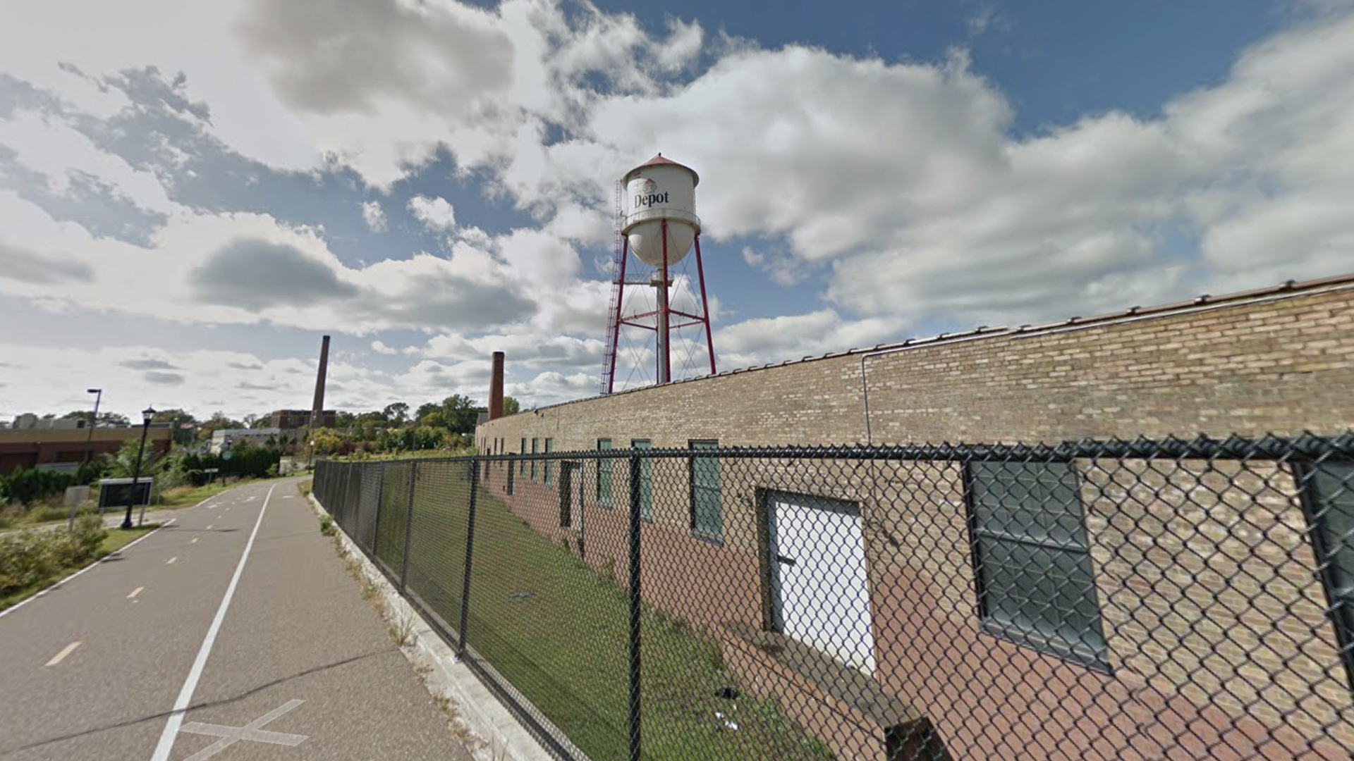 A water tower with Roof Depot
