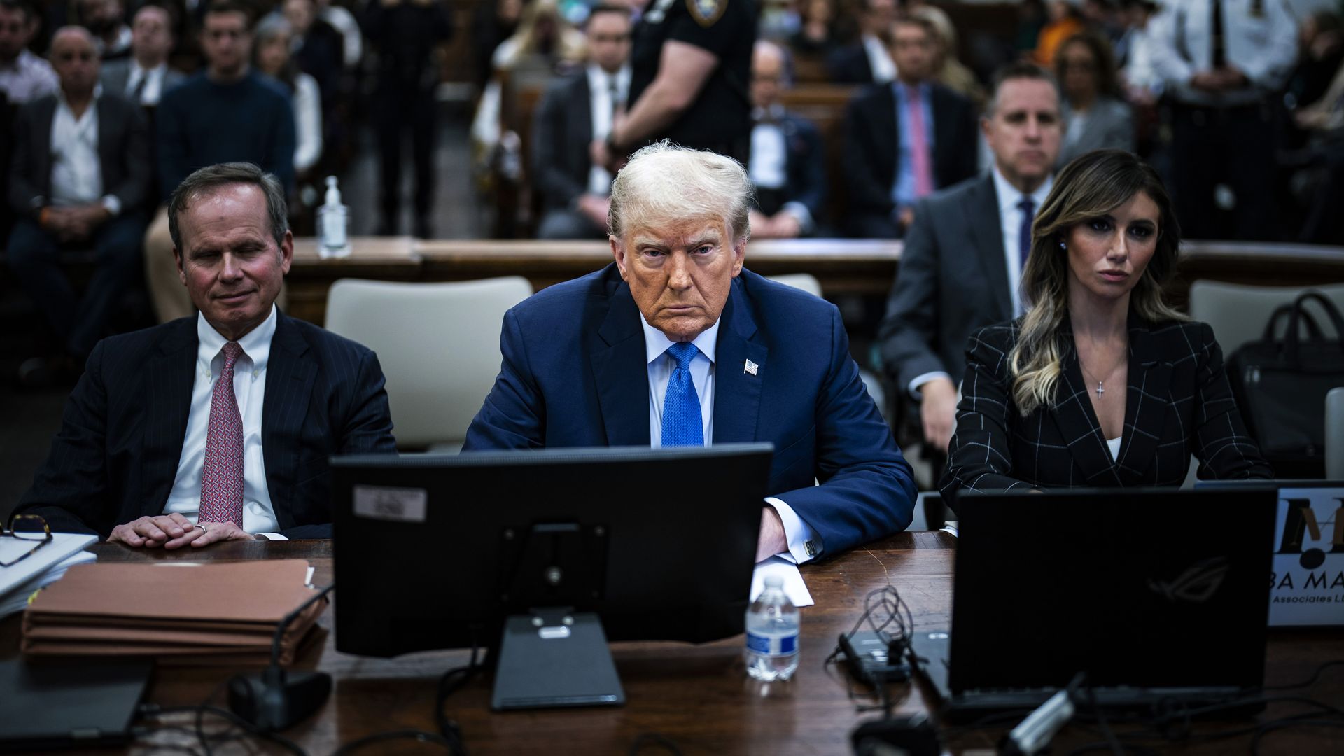 Former U.S. President Donald Trump (C) sits in the courtroom during his civil fraud trial at New York State Supreme Court on November 06, 2023 in New York City.