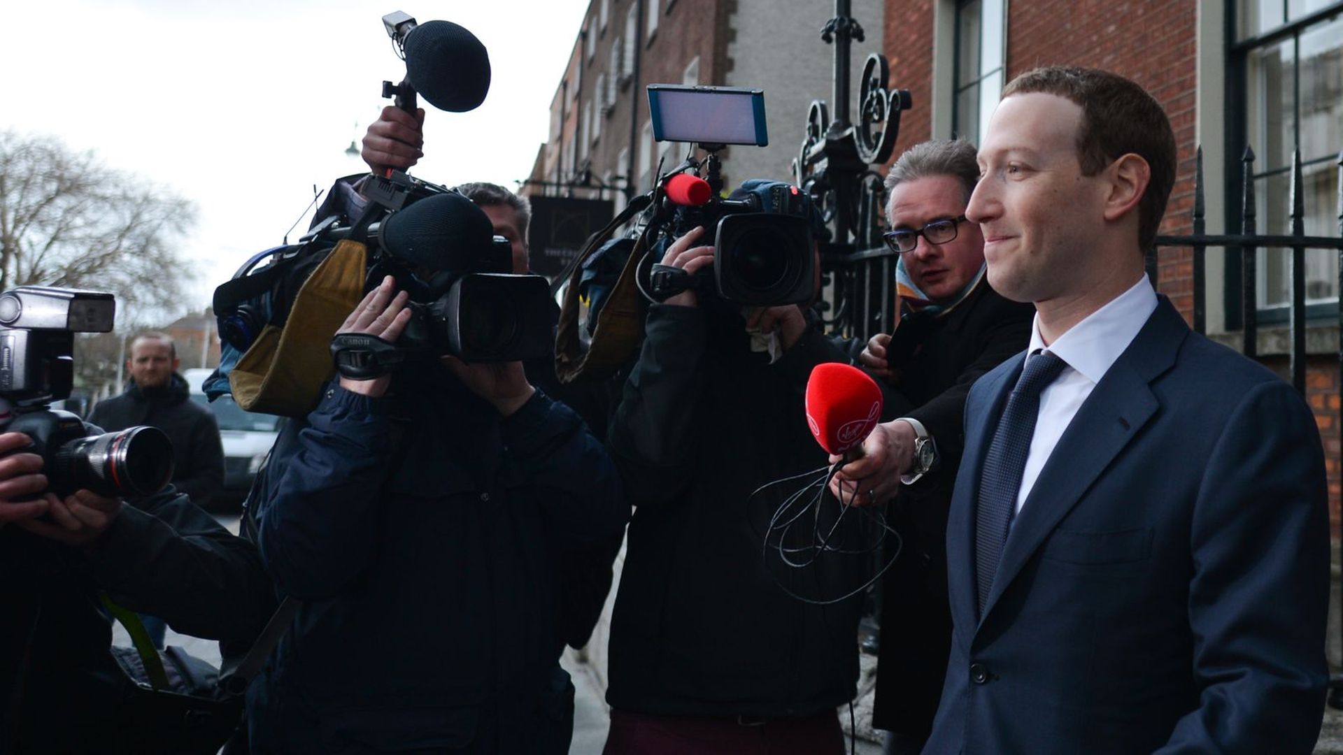 Facebook CEO Mark Zuckerberg in front of a bunch of TV cameras