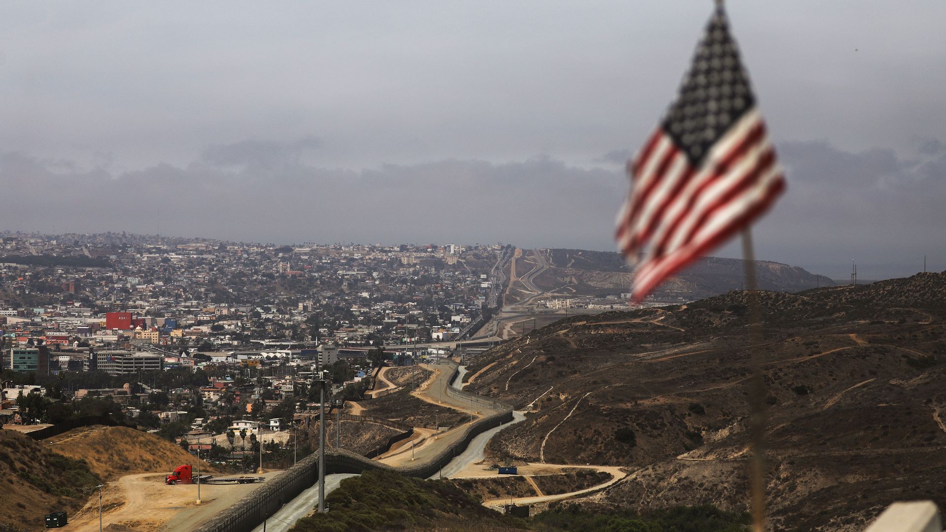 An American flag above the San Diego-Tijuana international border