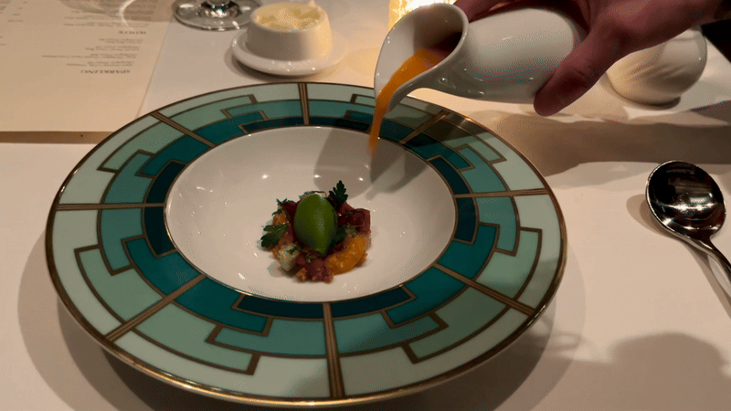 soup being poured into a bowl