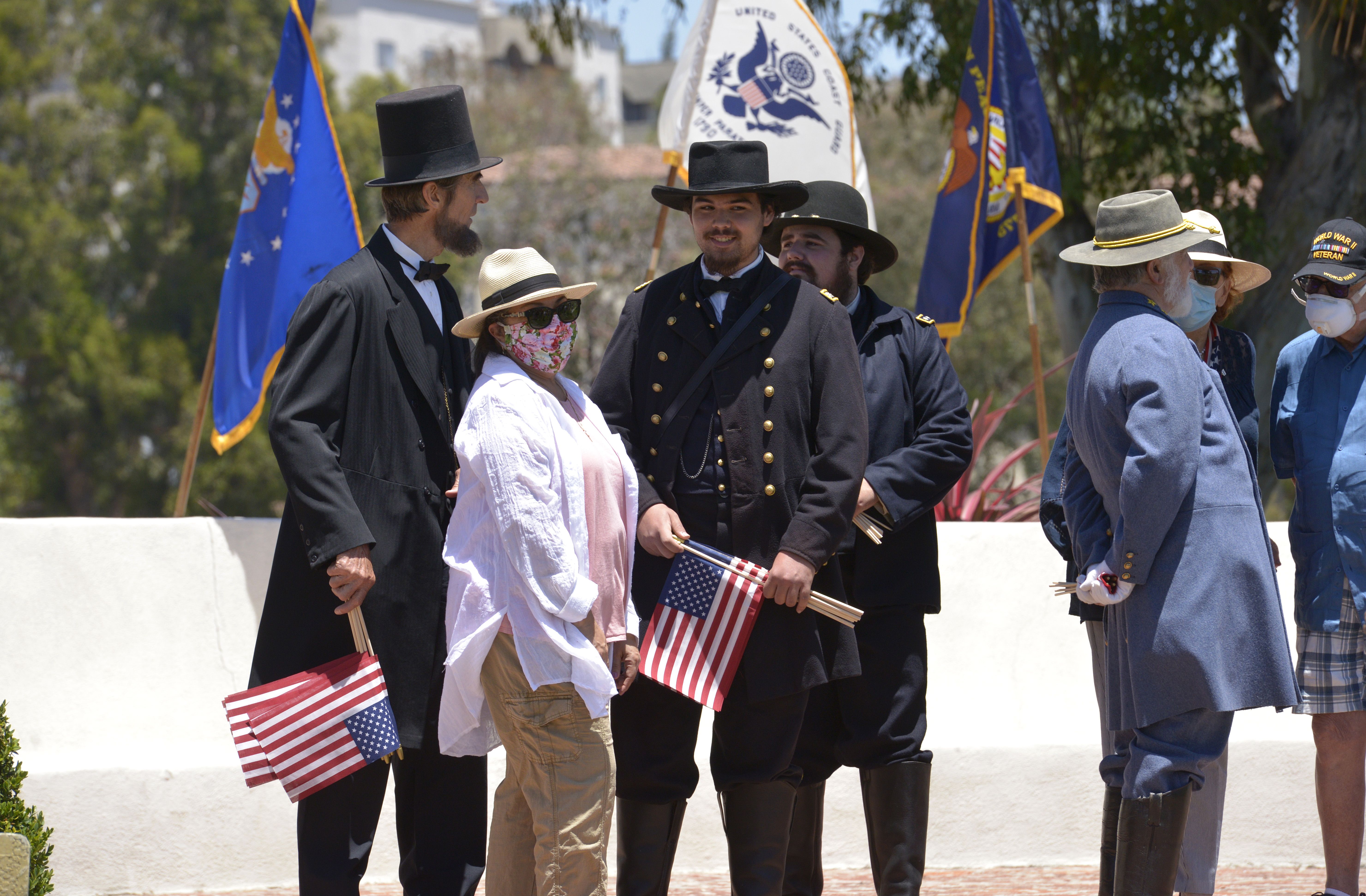 An Abraham Lincoln and Civil War-era actors interact with the public at Los Angeles National Cemetery