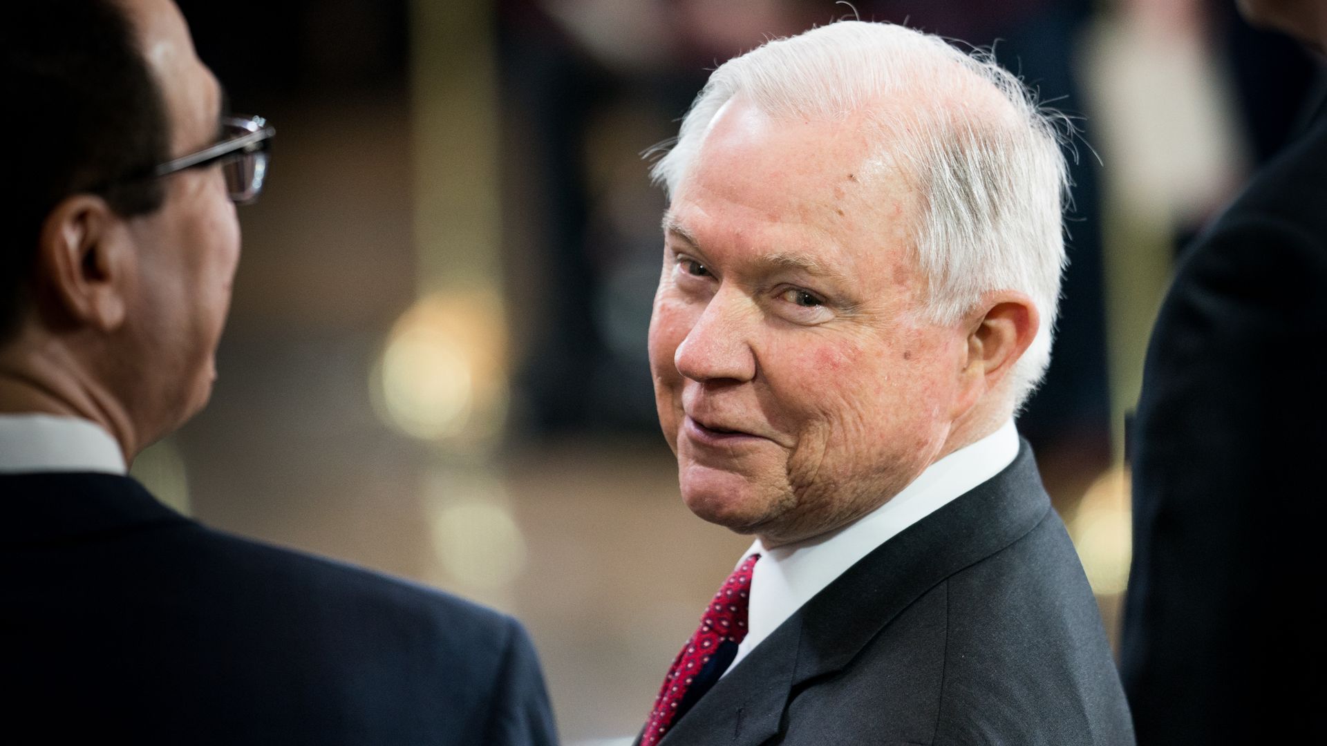 Jeff Sessions looks back over his shoulder