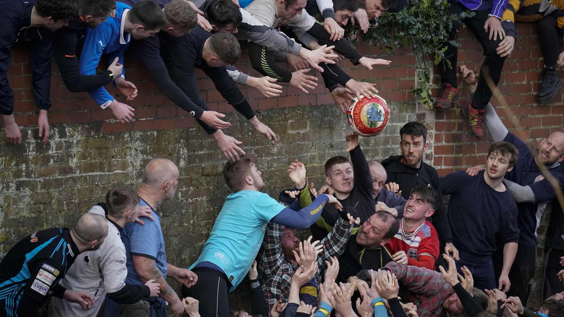 Participants during the annual Royal Shrovetide Football match
