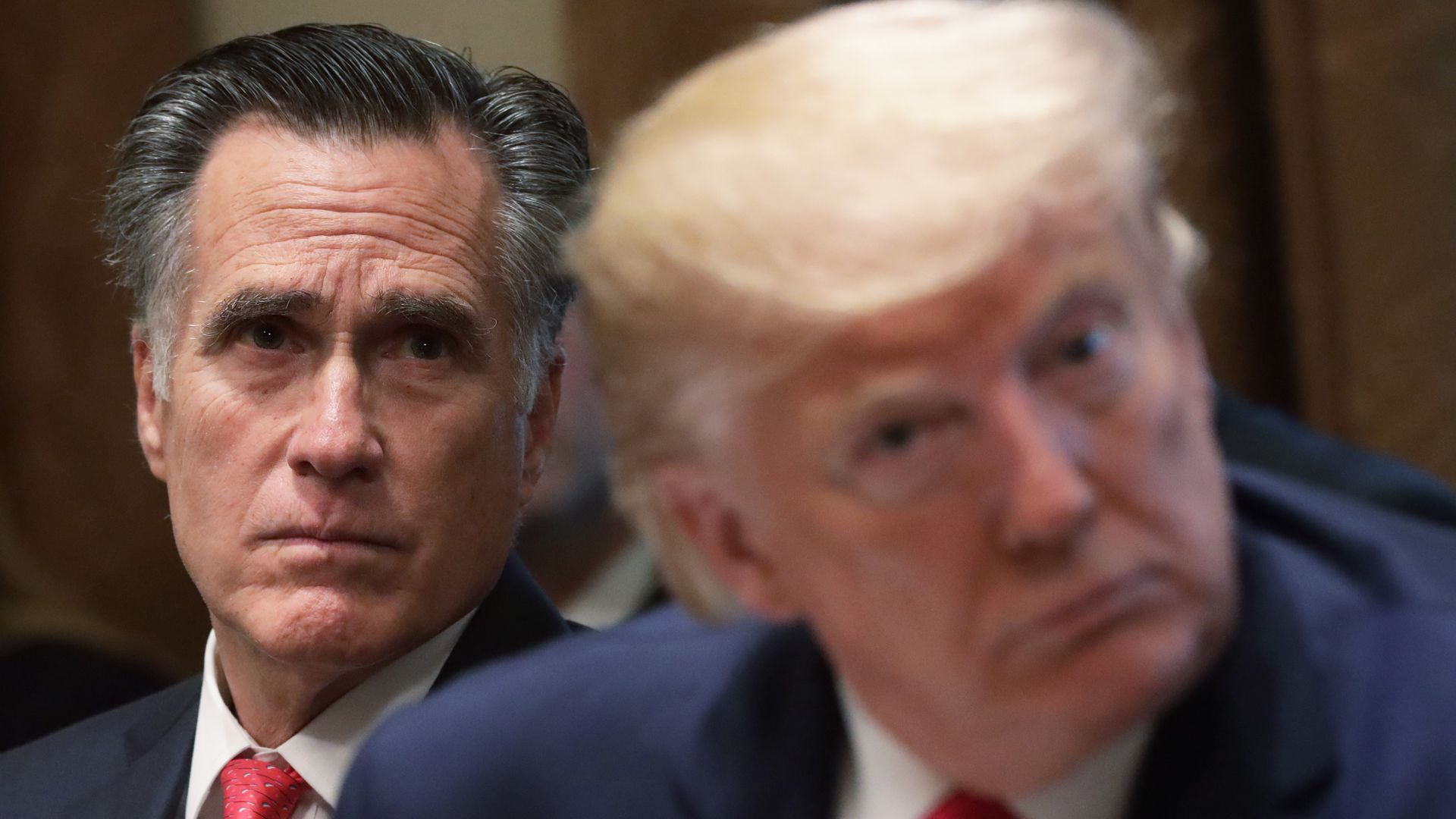 Romney seated next to Trump