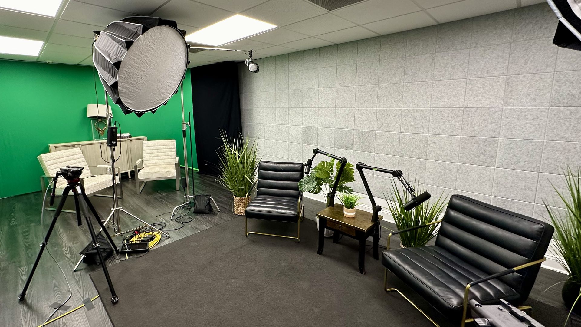 Photo shows an office space that has been converted into a podcasting area.