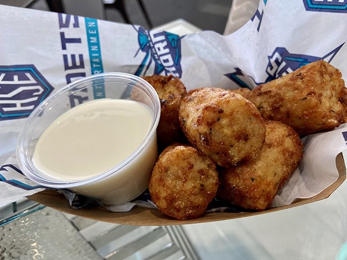 Stuffed tater tots with bacon and cheddar. Photo: Ashley Mahoney/Axios 