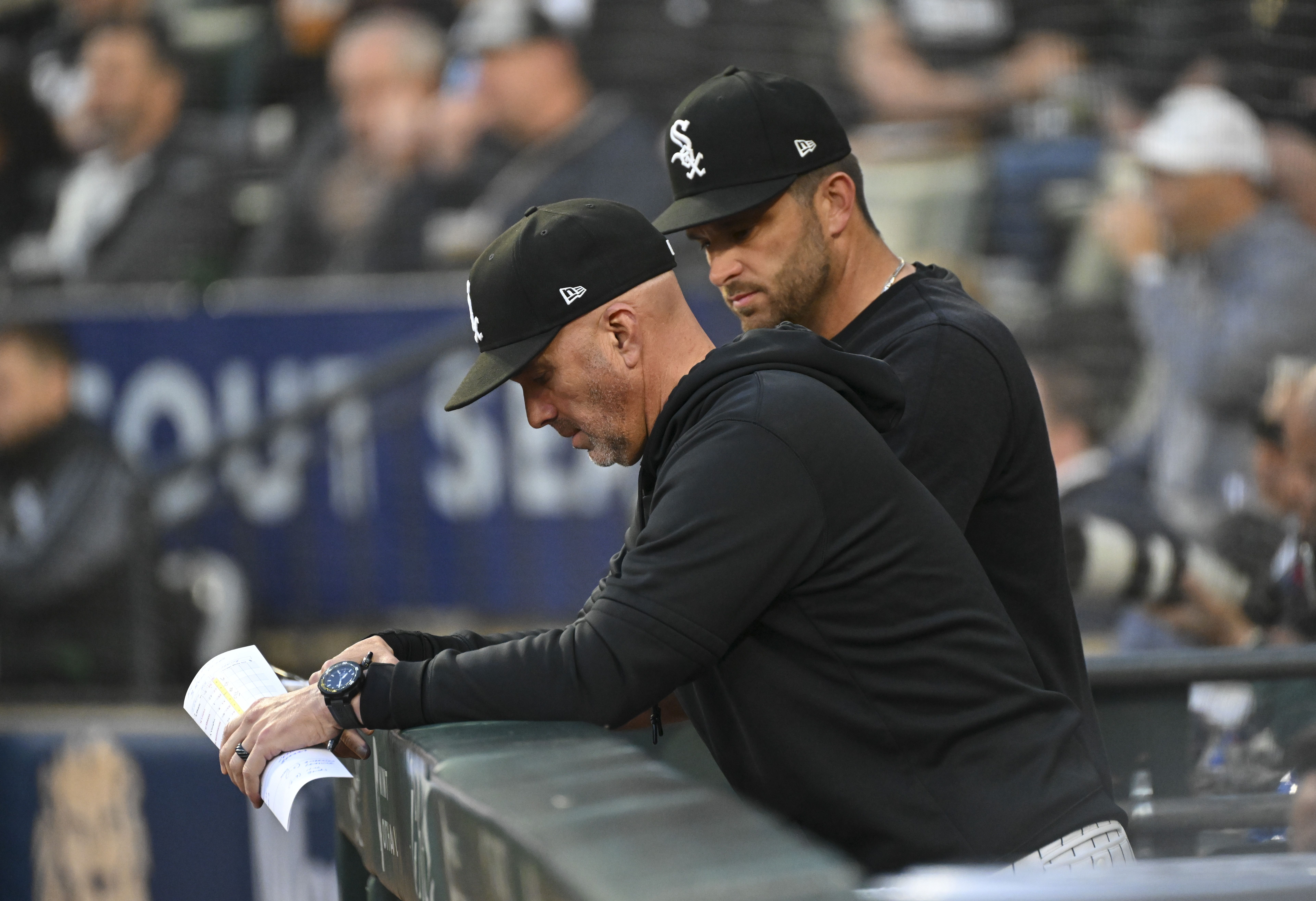 Photo of a baseball manager with his head down