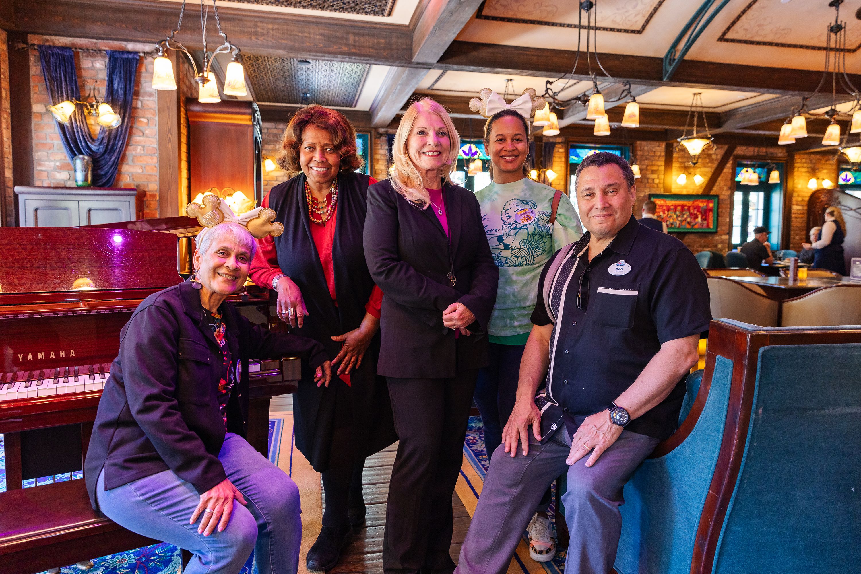 Stella Chase Reese and her daughter pose at Disneyland with Carmen, one of the imagineers who is leading the project for Tiana's Bayou Adventure.
