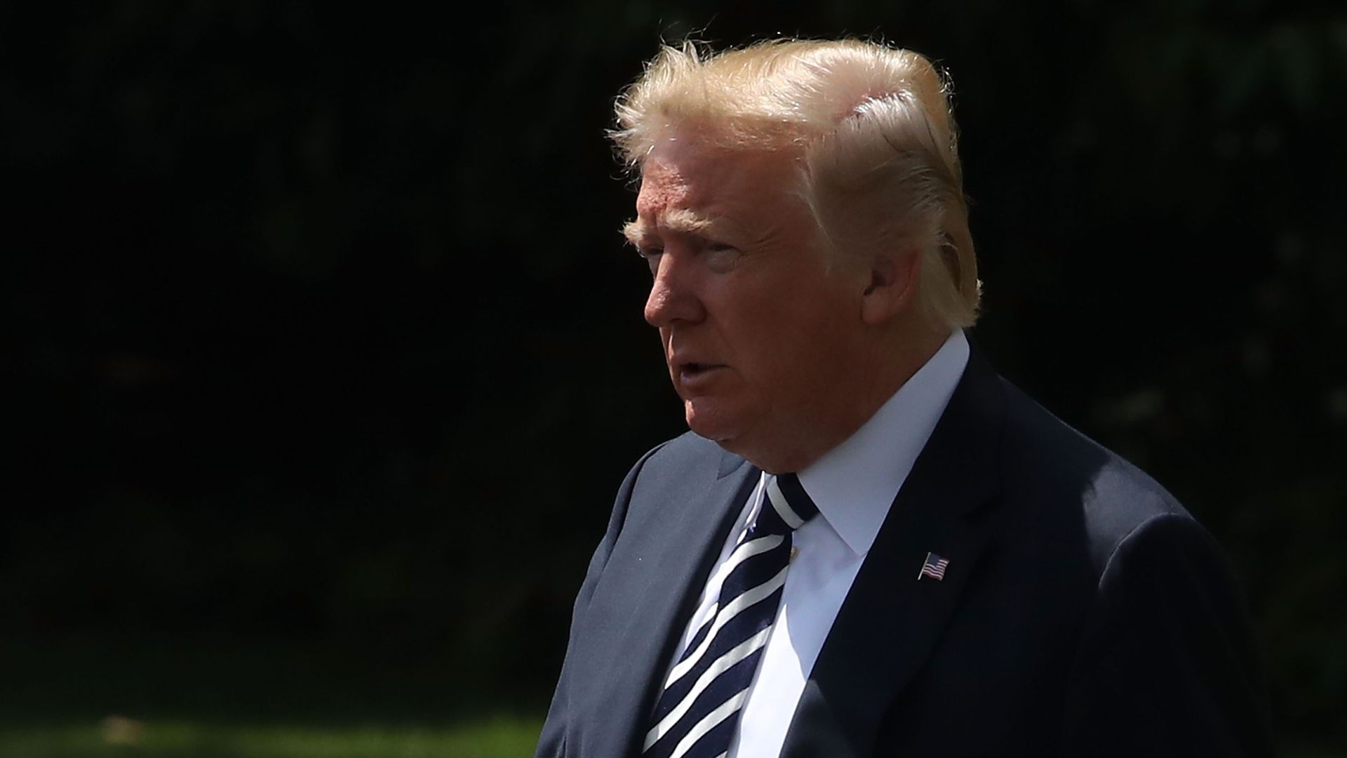 Donald Trump walks on the south lawn of the White House