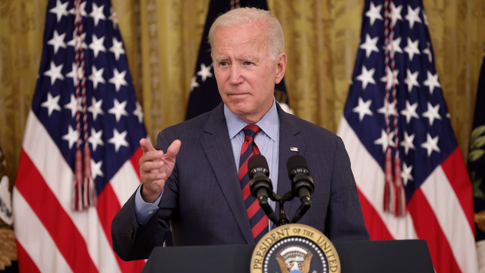 President Joe Biden takes questions during an event in the East Room of the White House August 3