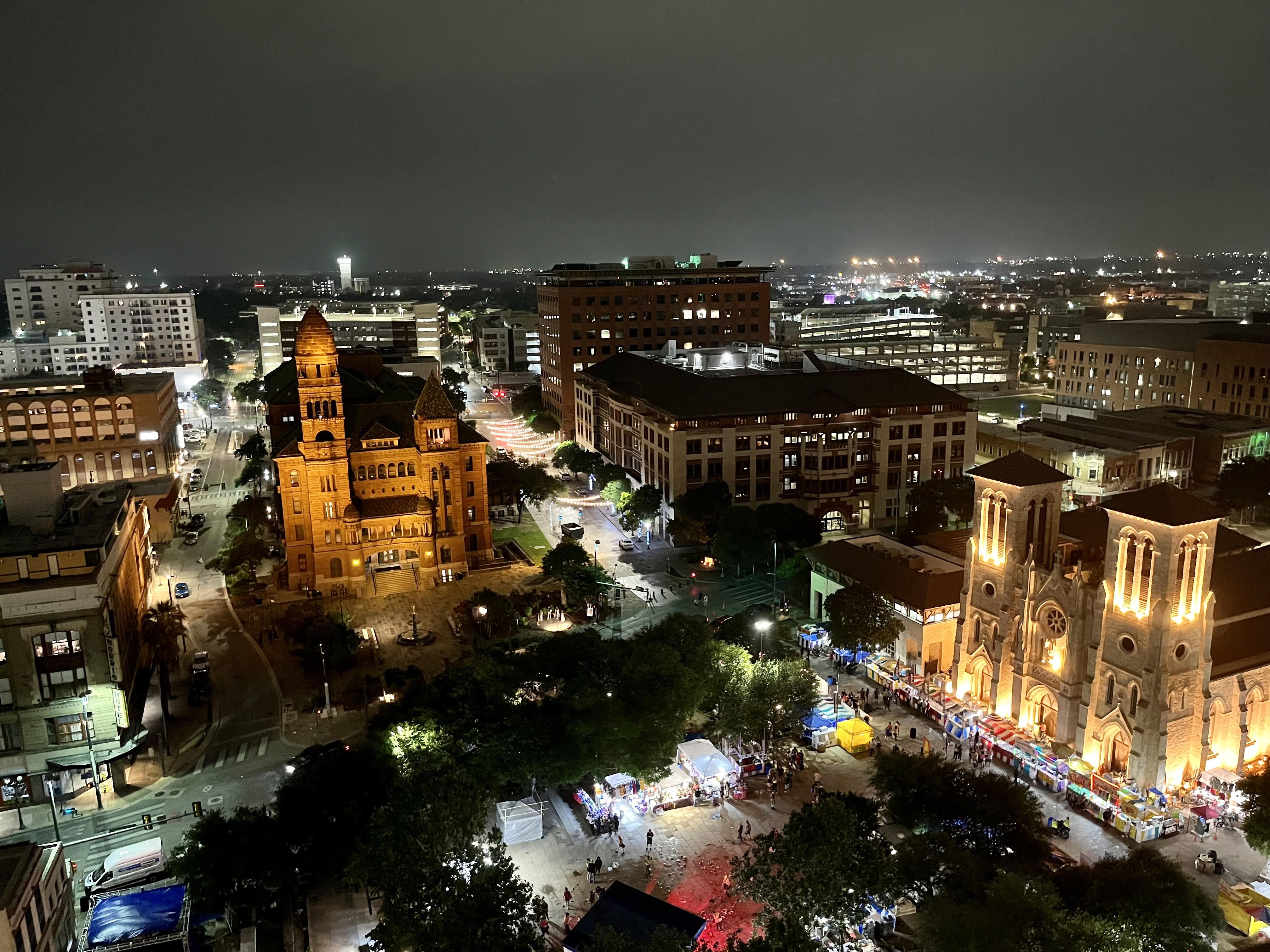 Downtown San Antonio is lit up with views of the historic Bexar County Courthouse and San Fernando Cathedral.