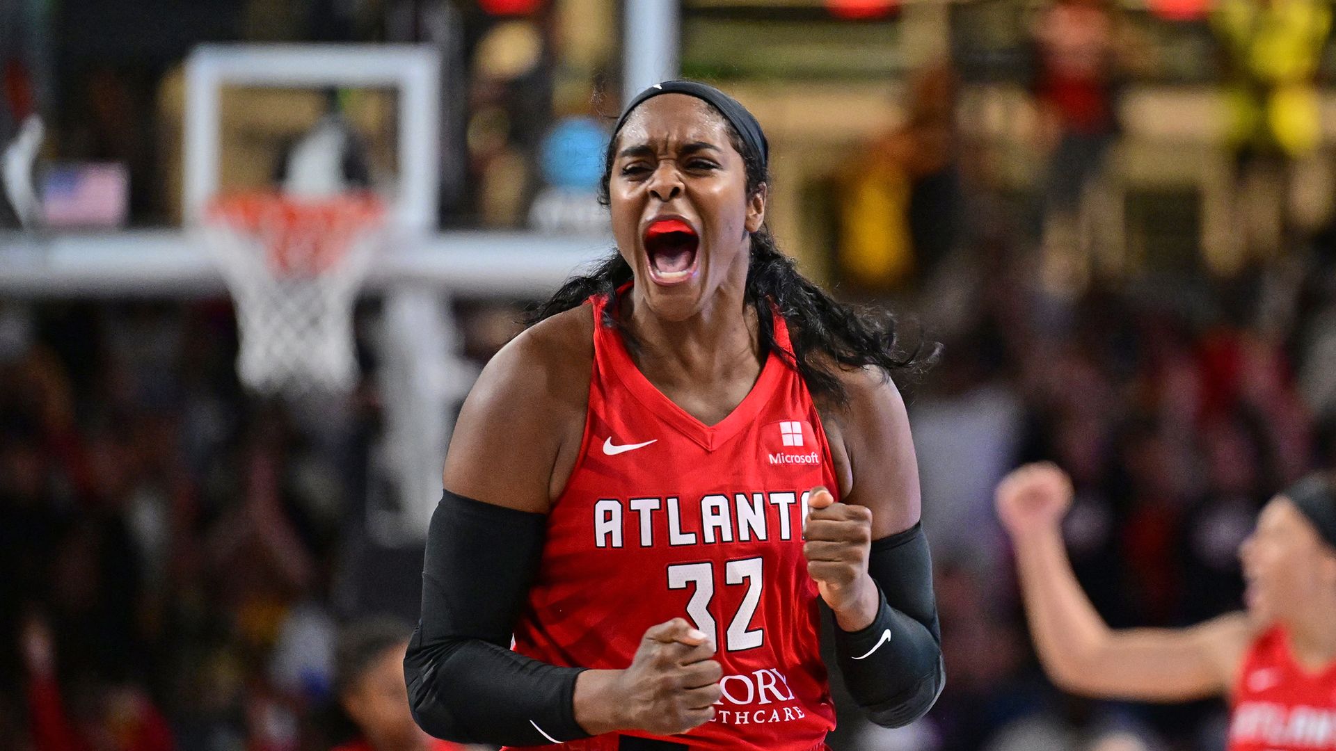 Cheyenne Parker-Tyus #32 of the Atlanta Dream celebrates during the game against the Dallas Wings on