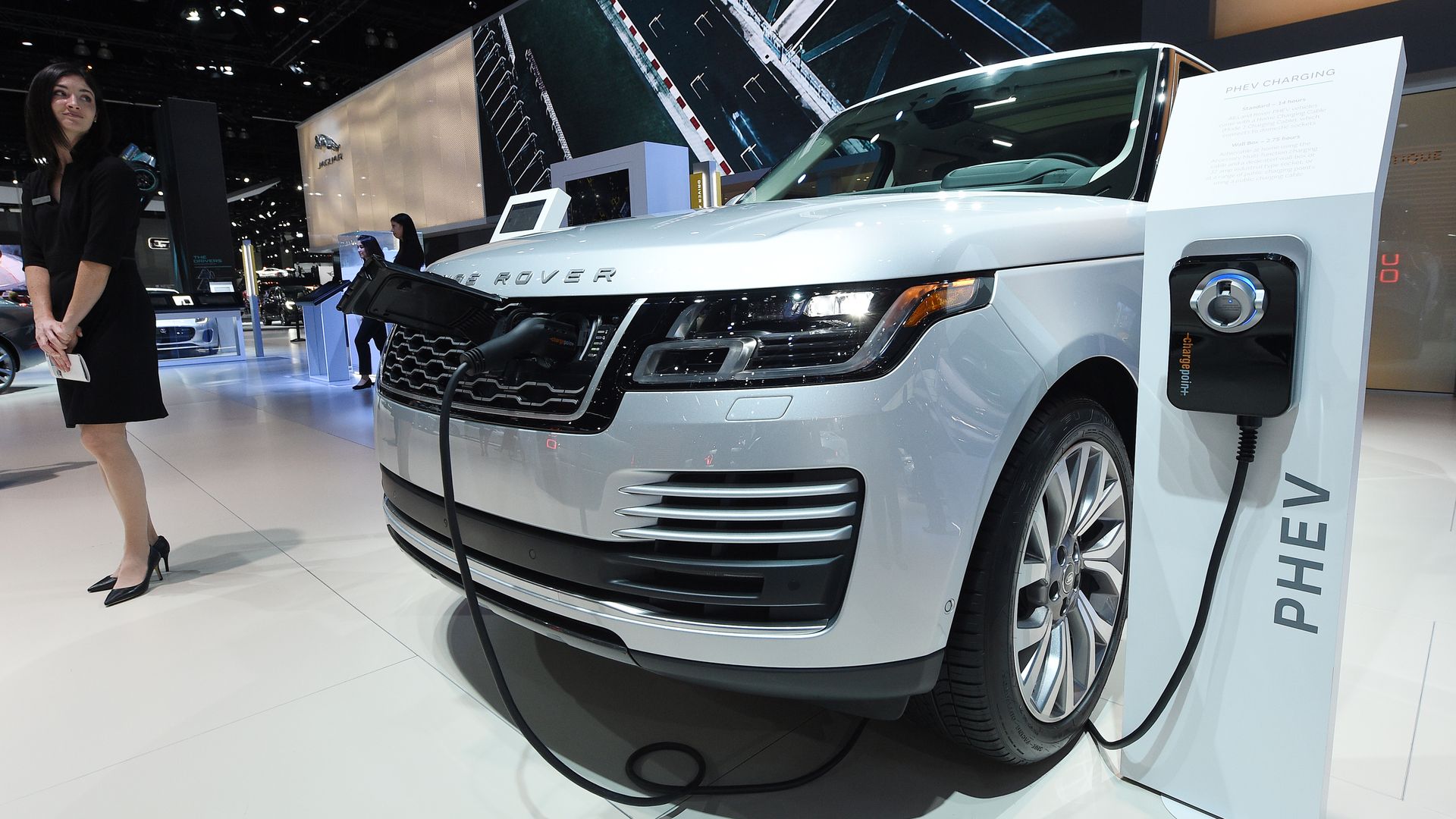 Hybrid Range Rover model and charging station at car show