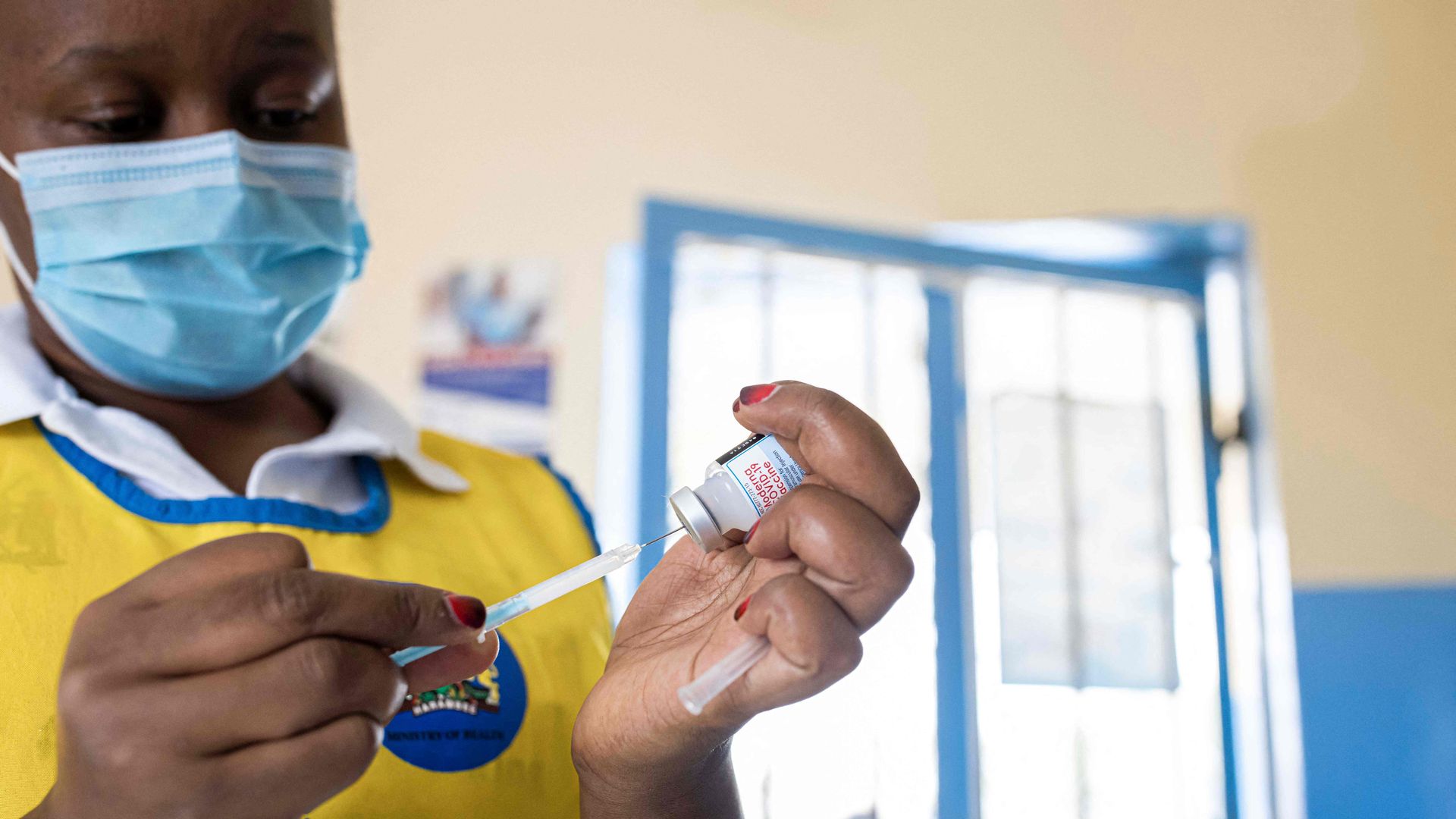 African nurse prepares dose