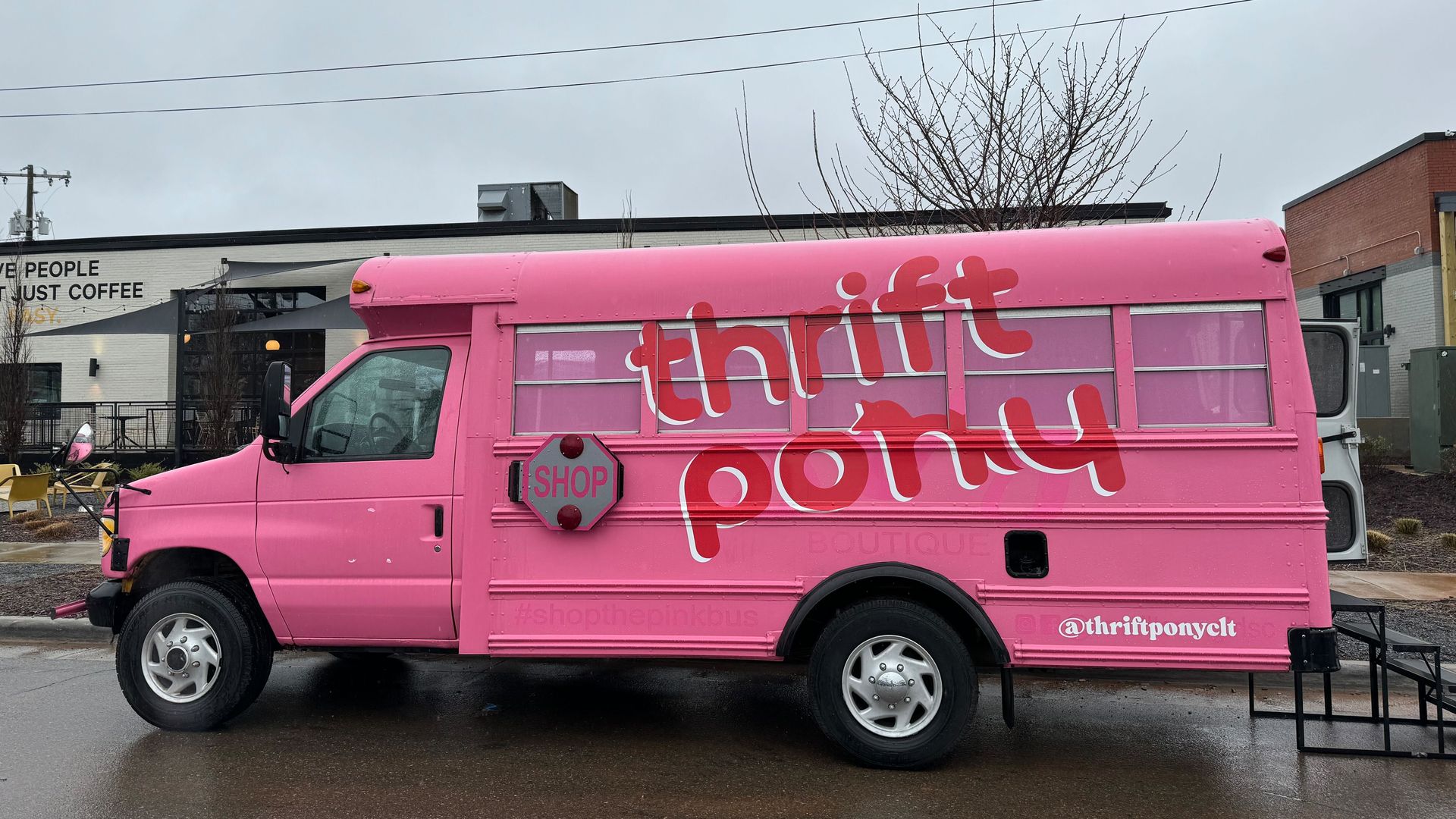Pink mini school bus that reads "thrift pony"