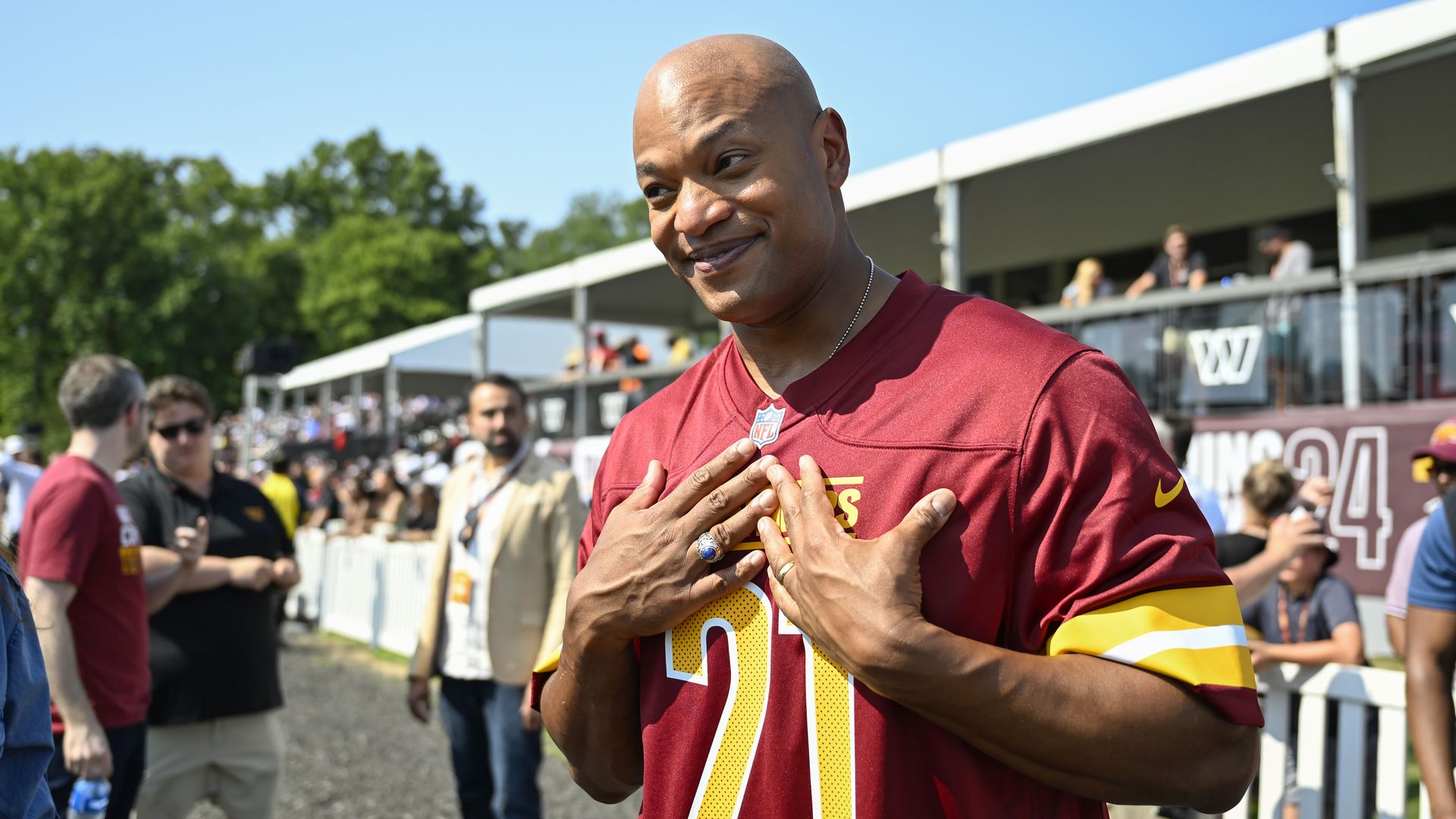 Wes Moore wears a #21 Washington Commanders jersey.