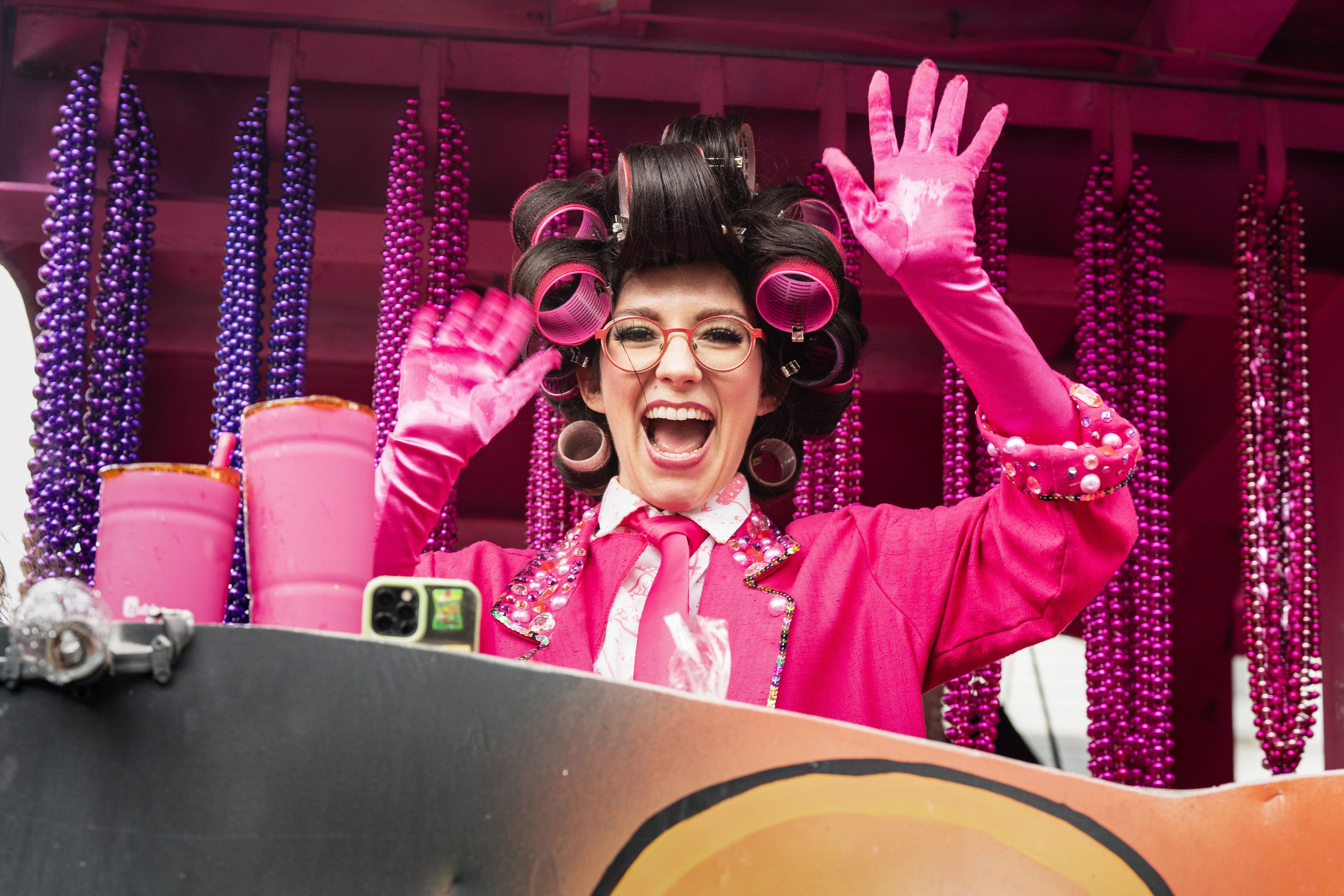 Photo shows rapper Boyfriend in a pink outfit with curlers.