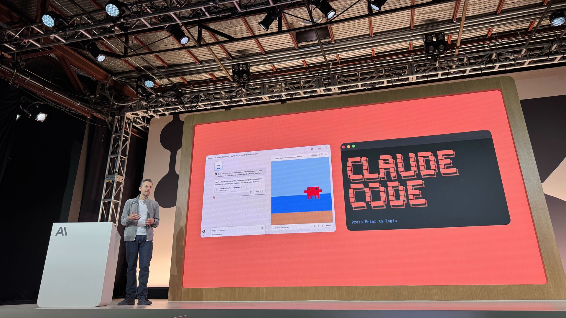 Photo of OpenAI's Mike Krieger at lectern underneath a screen showing the words "Claude Code"