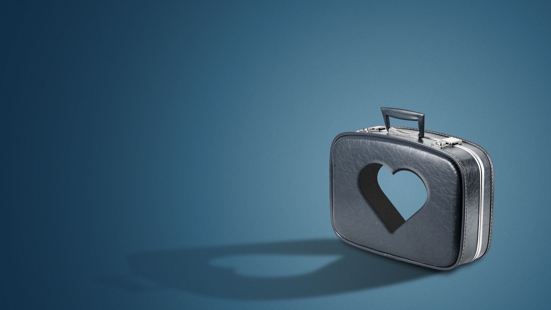 Illustration of a cutout of a heart in the middle of a suitcase.