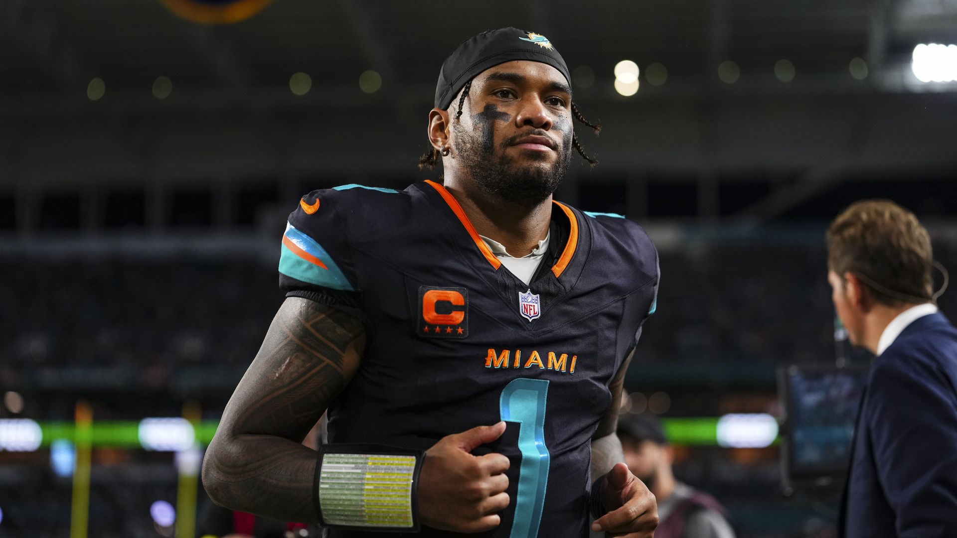 MIAMI GARDENS, FL - SEPTEMBER 29: Tua Tagovailoa#1 of the Miami Dolphins walks off of the field at halftime during an NFL football game against the New York Jets at Hard Rock Stadium on September 29, 2025 in Miami Gardens, Florida. (Photo by Cooper Neill/Getty Images)
