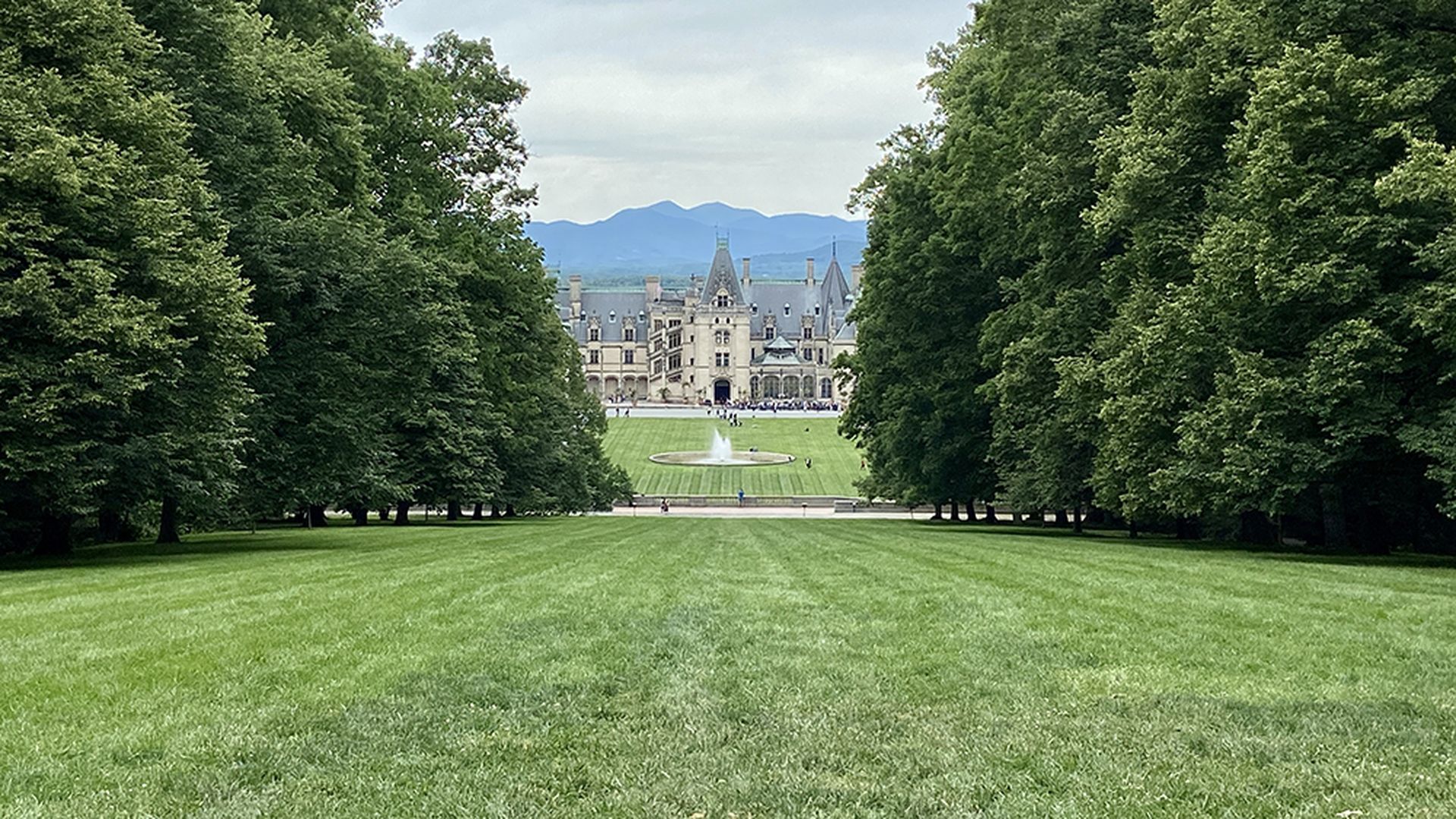 Biltmore Estate in Asheville with the Blue Ridge Mountains in the background.