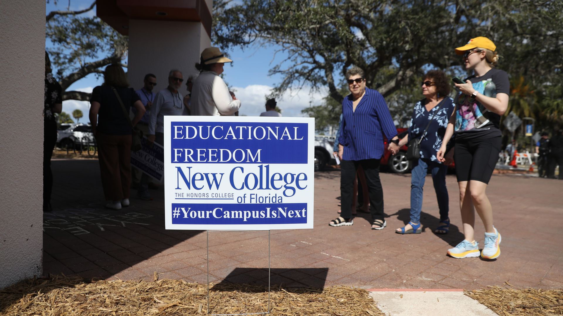 A yard sign that reads "EDUCATIONAL FREEDOM New College of Florida #YourCampusIsNext."