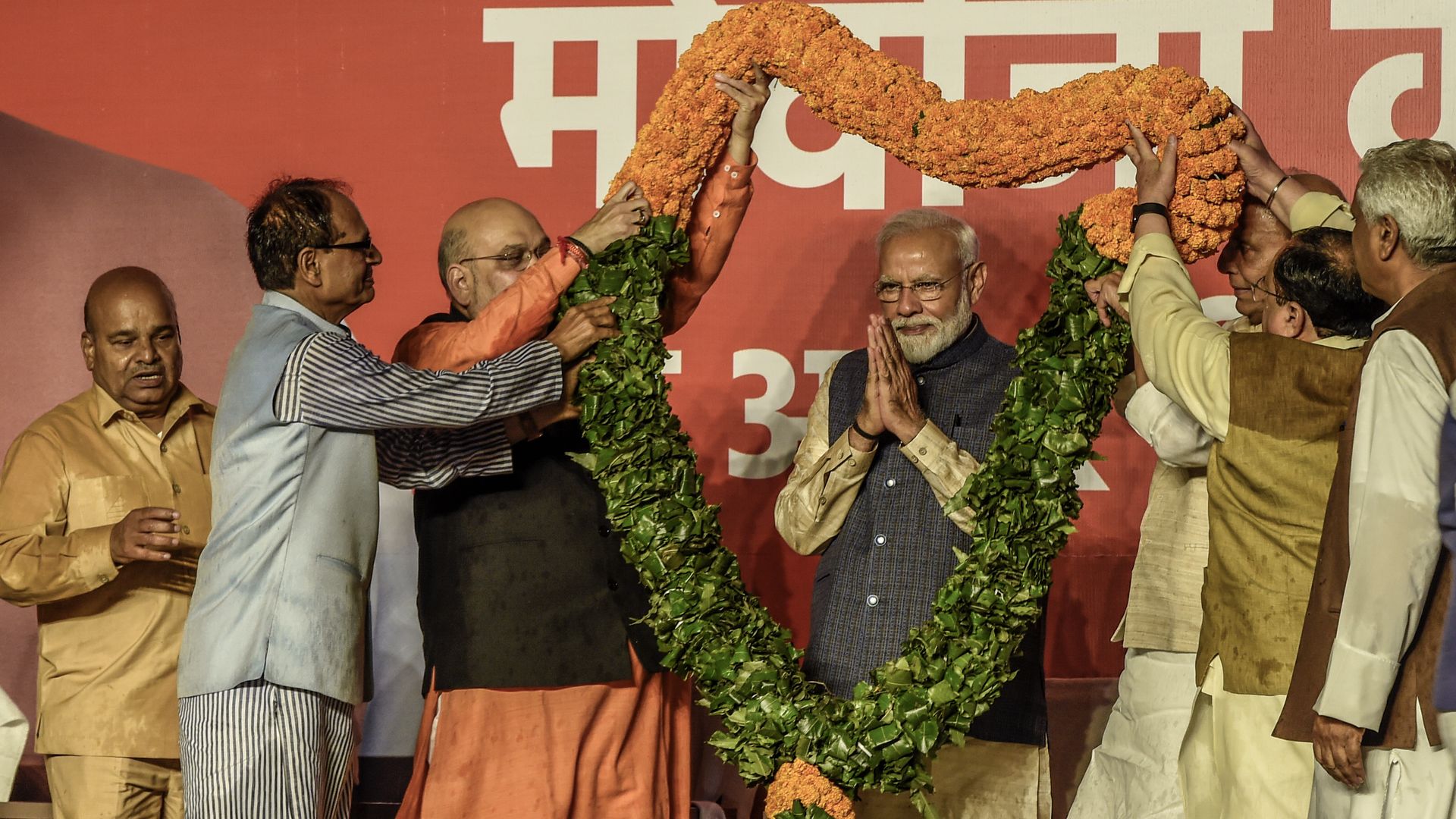 Narendra Modi with a large floral garland