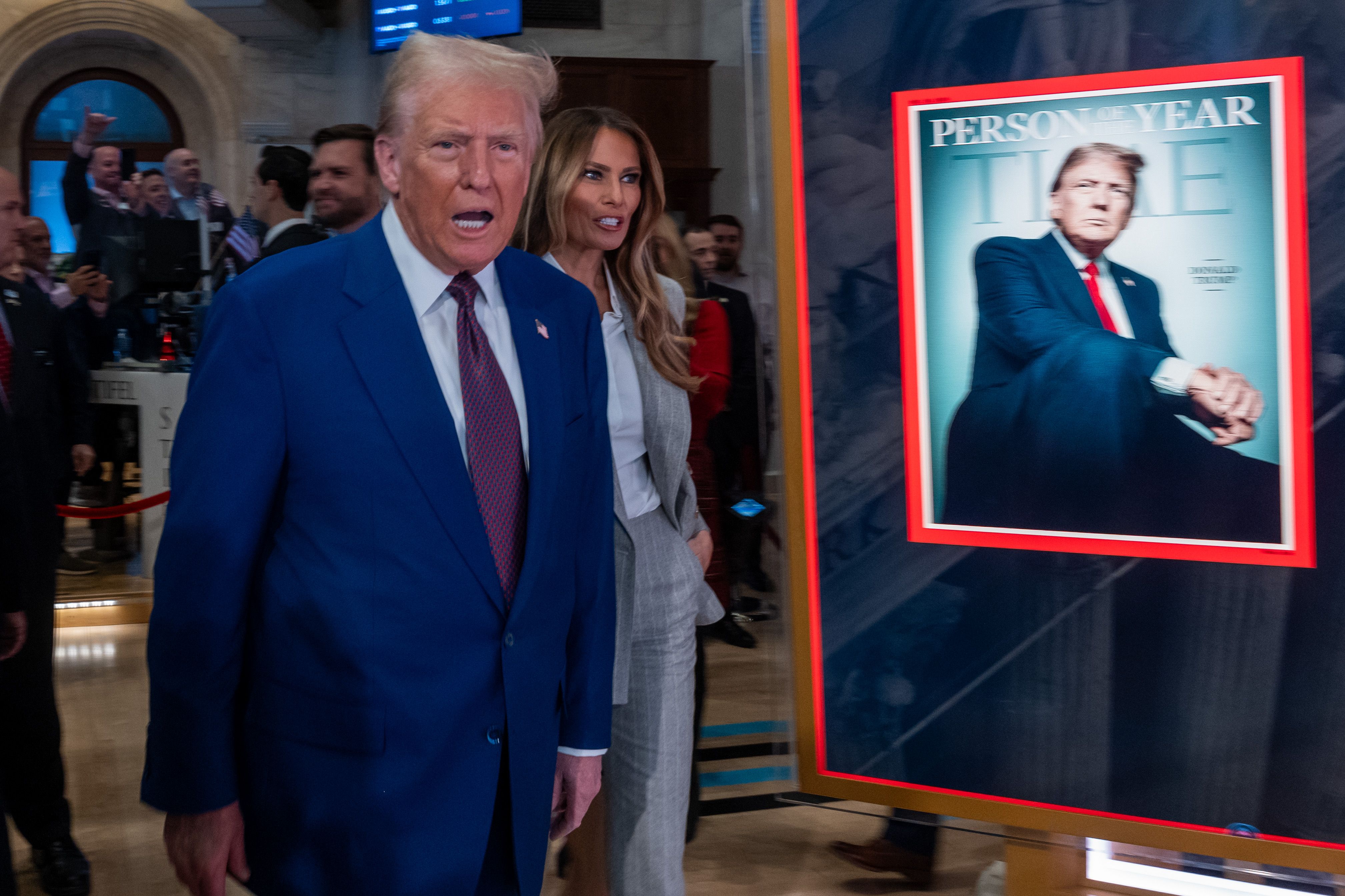 President-elect Trump walks onto the floor of the New York Stock Exchange with his wife, Melania, yesterday. Photo: Spencer Platt/Getty Images
