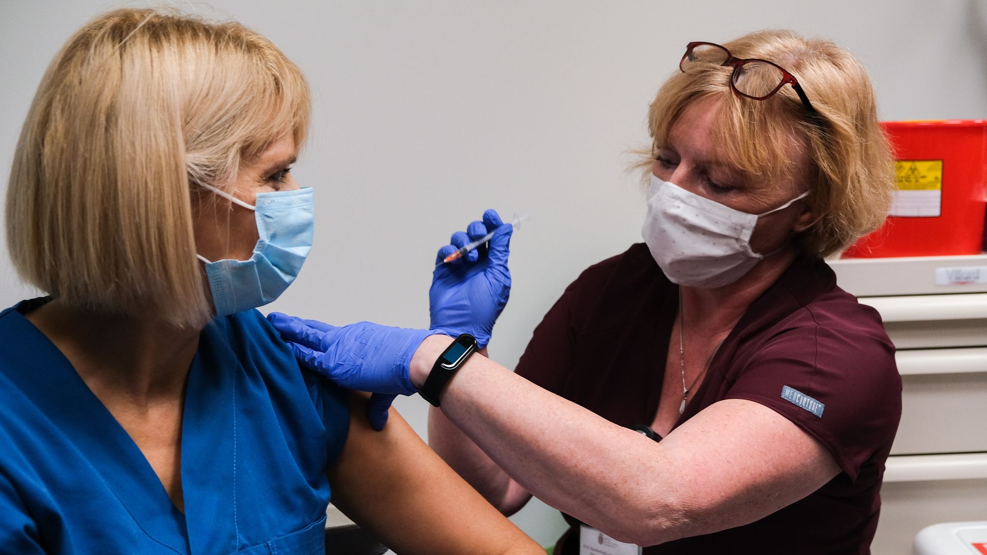 Krystyna Matusik, a nurse from the Intensive Care Unit is given the first jab of Pfizer BioNTech Covid-19 vaccine