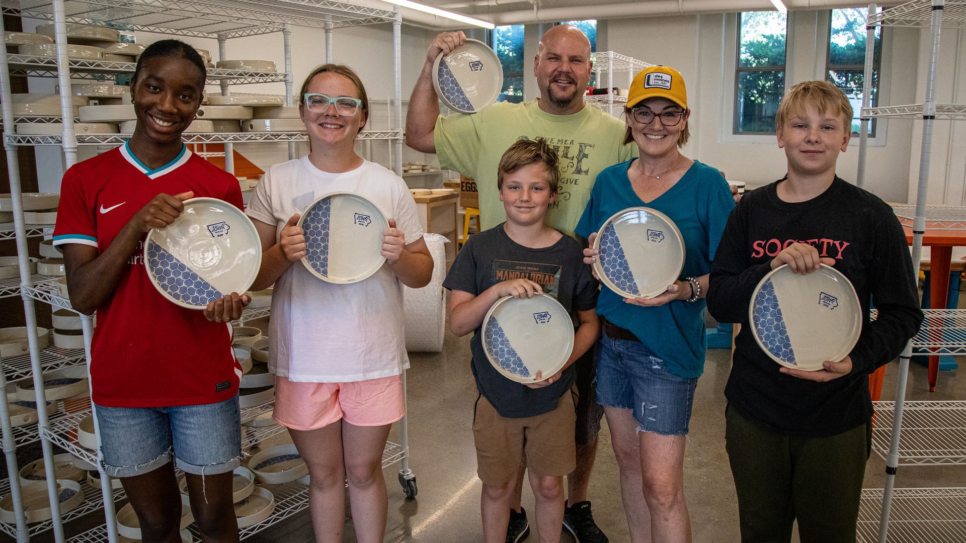 Central Campus students and teachers show their pottery trays