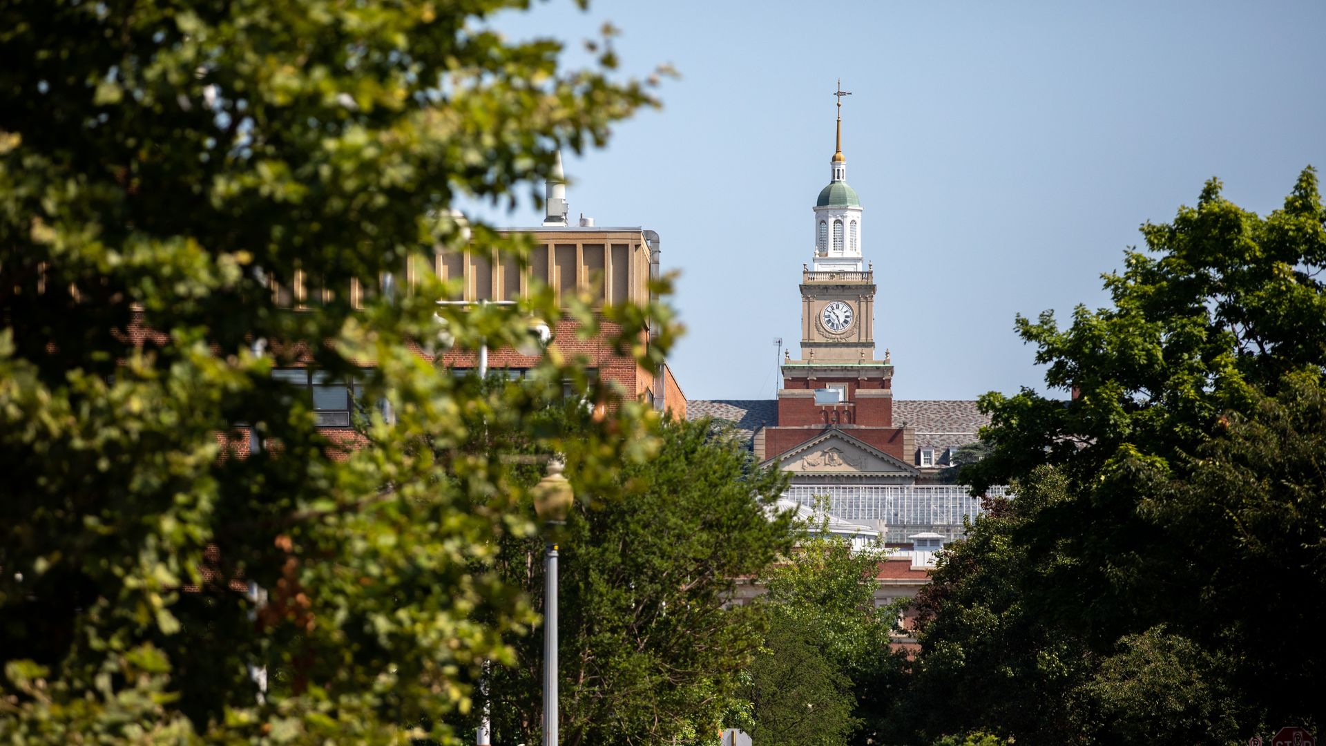 The iconic clocktower of Howard University looms over the LeDroit Park neighborhood of Washington, D.C. on Friday, July 16, 2021