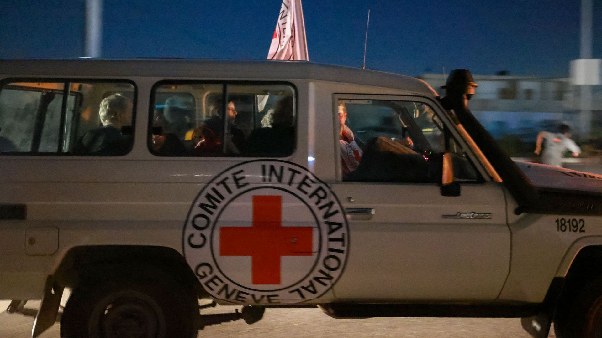 An International Red Cross vehicle reportedly carrying hostages released by Hamas crosses the Rafah border point in the Gaza Strip towards Egypt on Nov. 24. Photo: Mohammed Abed/AFP via Getty Images