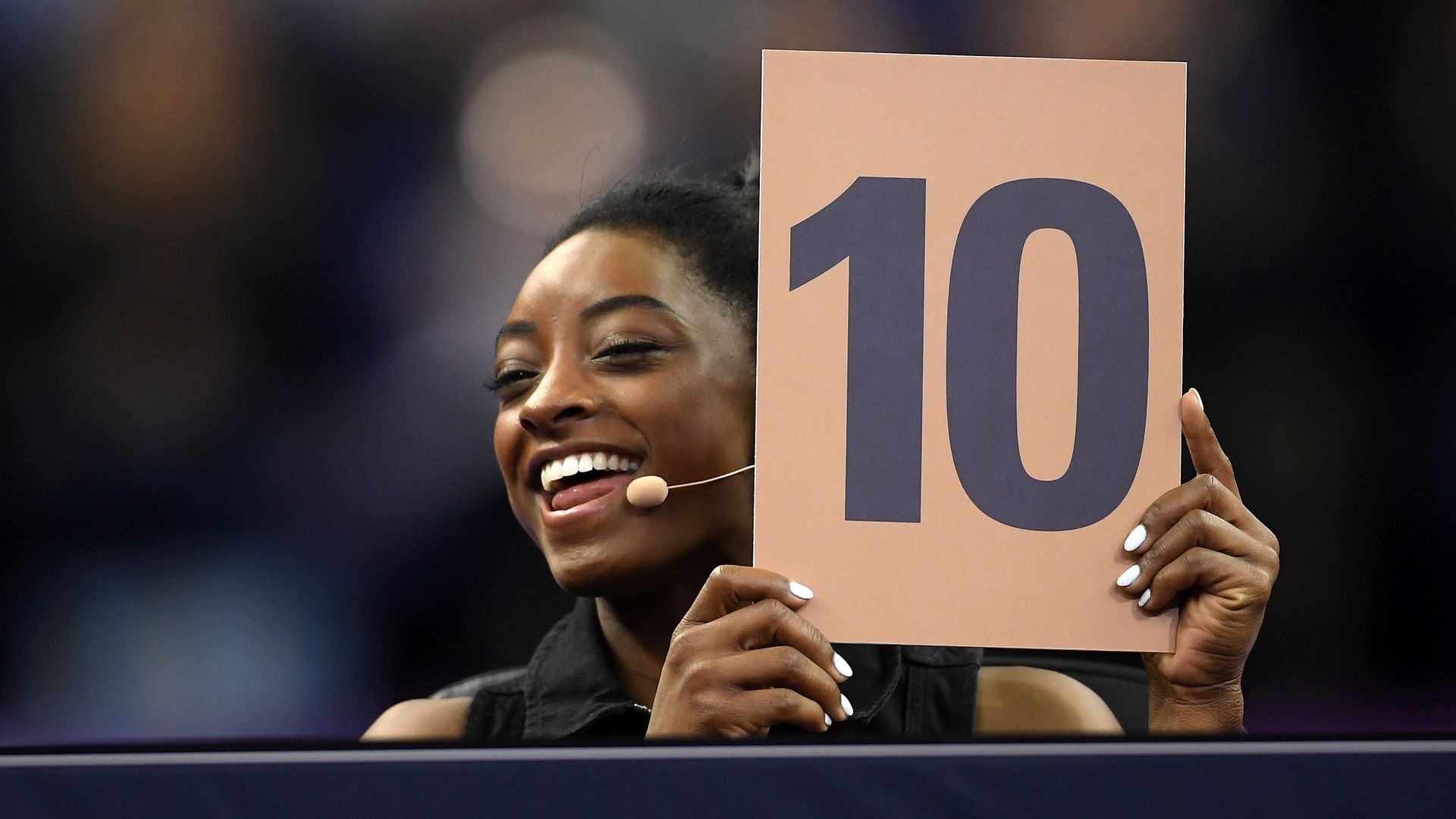 Judge, Simone Biles of the USA awards