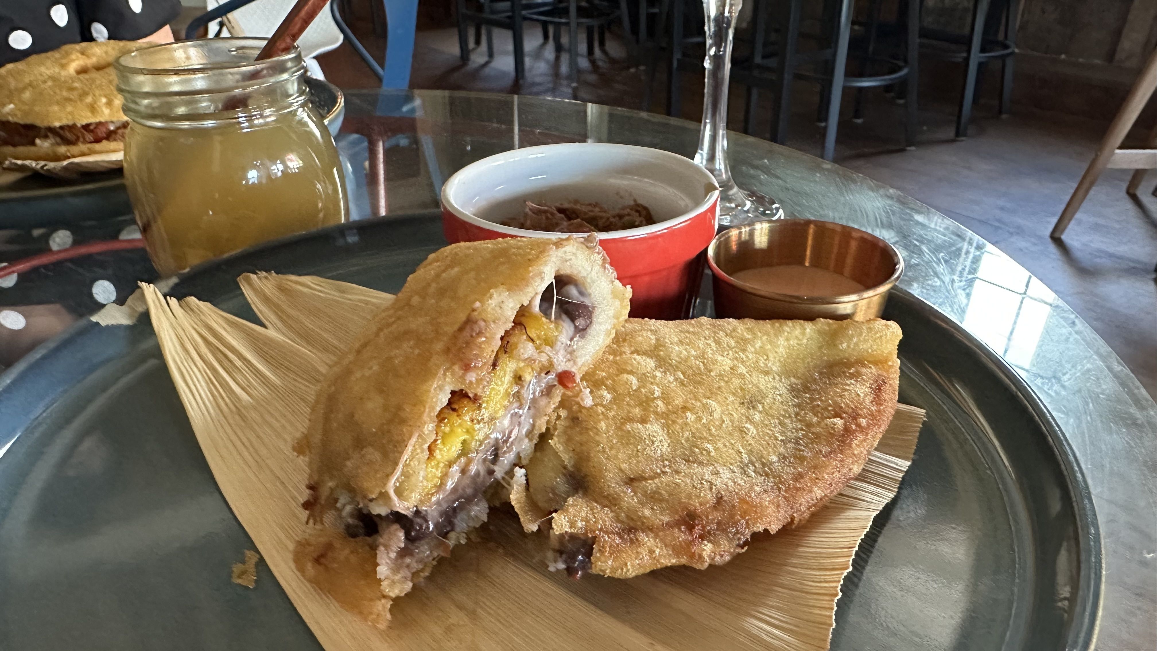A photo of an empanada that's been cut in half.