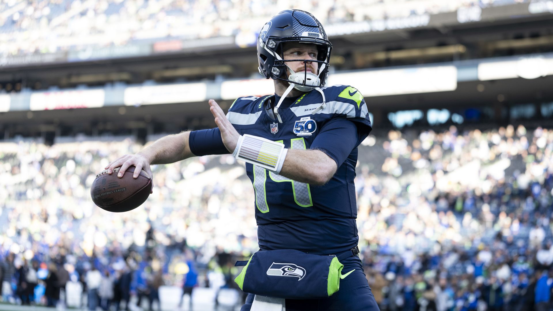 Seattle QB Sam Darnold prepares to throw the ball. 