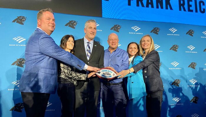 Panthers general manager Scott Fitterer, Linda Reich, Panthers head coach Frank Reich, team owners David and Nicole Tepper and team president Kristi Coleman at Reich's introductory press conference.
