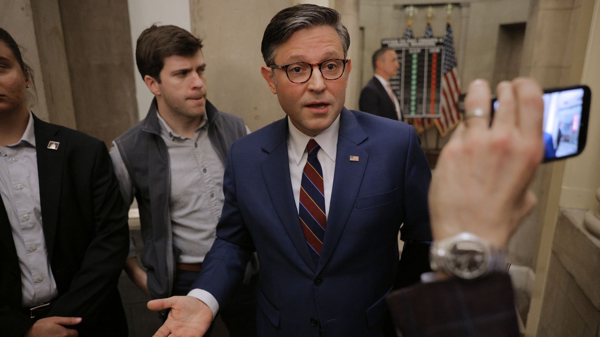 Speaker Johnson speaks with reporters outside of his office in the Capitol 