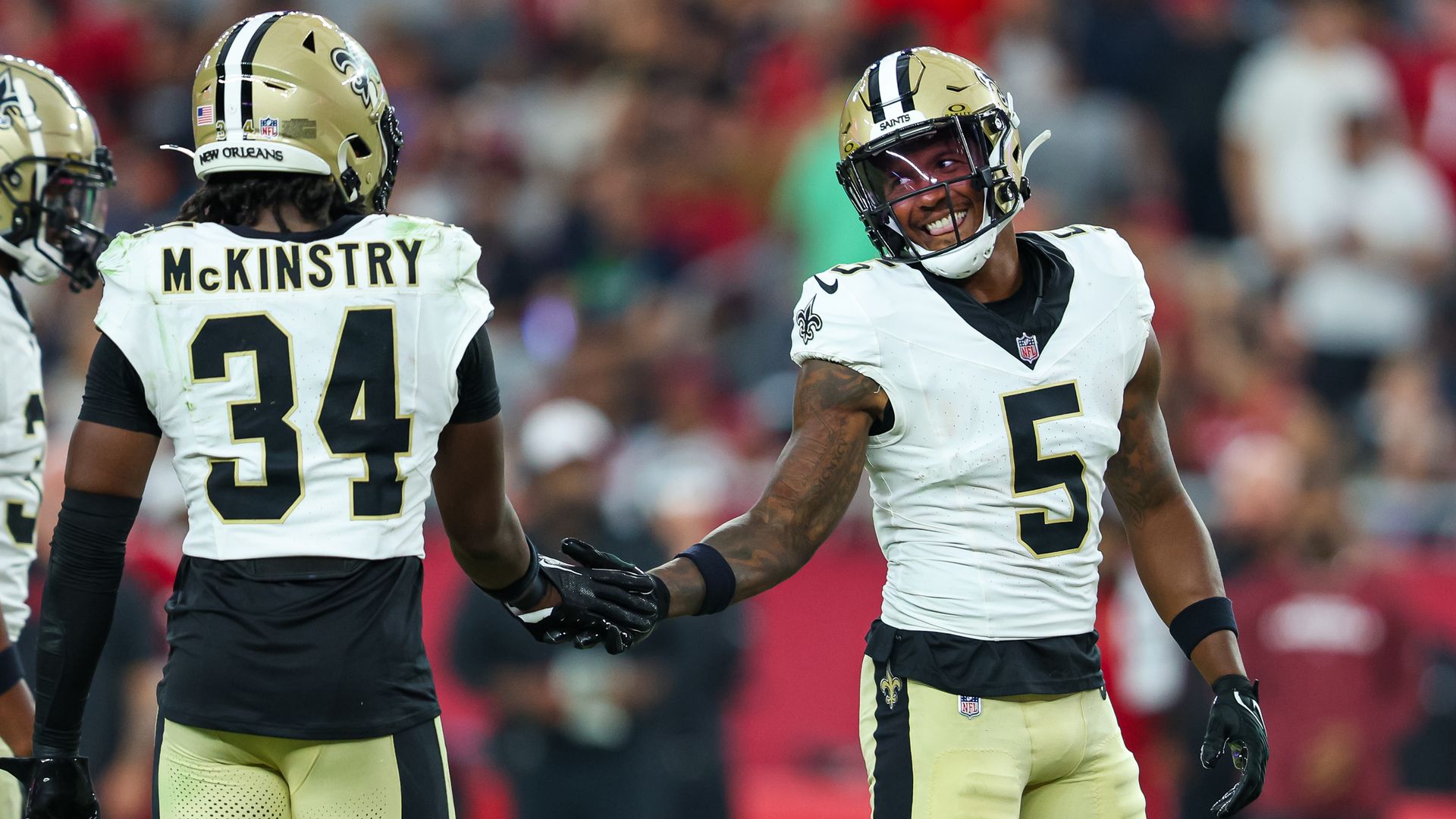 Photo shows Will Harris #5 and Kool-Aid McKinstry of the Saints.