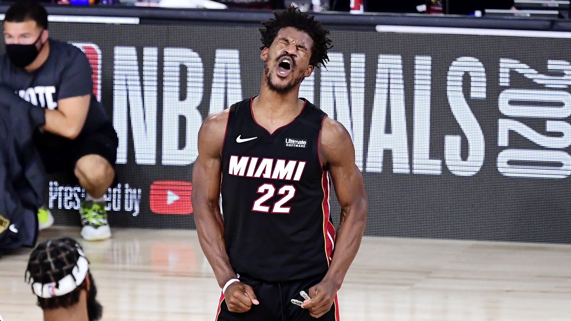 jimmy butler celebrating during game 3 of the nba finals 