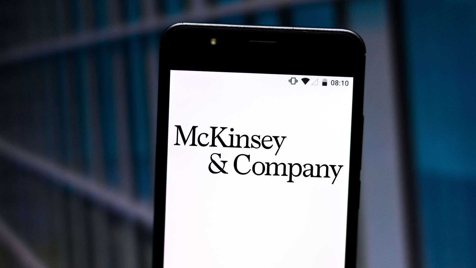 McKinsey & Company logo displayed on a smartphone.