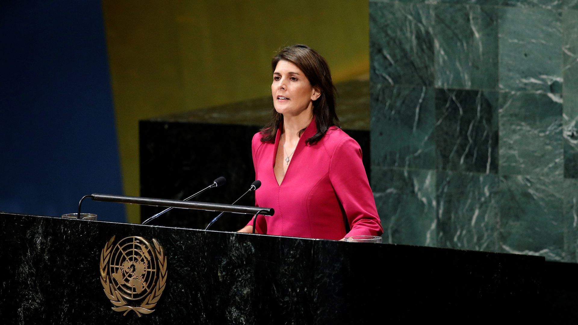 Nikki Haley speaks behind a podium