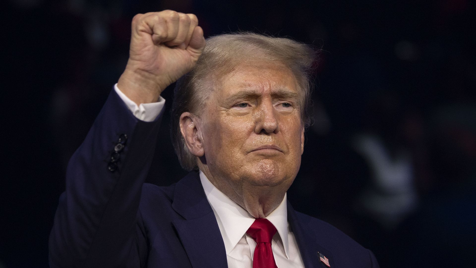  Former President Donald Trump walks on to the stage to give the keynote address at Turning Point Action's "The People's Convention" on June 15, 2024 in Detroit, Michigan. 