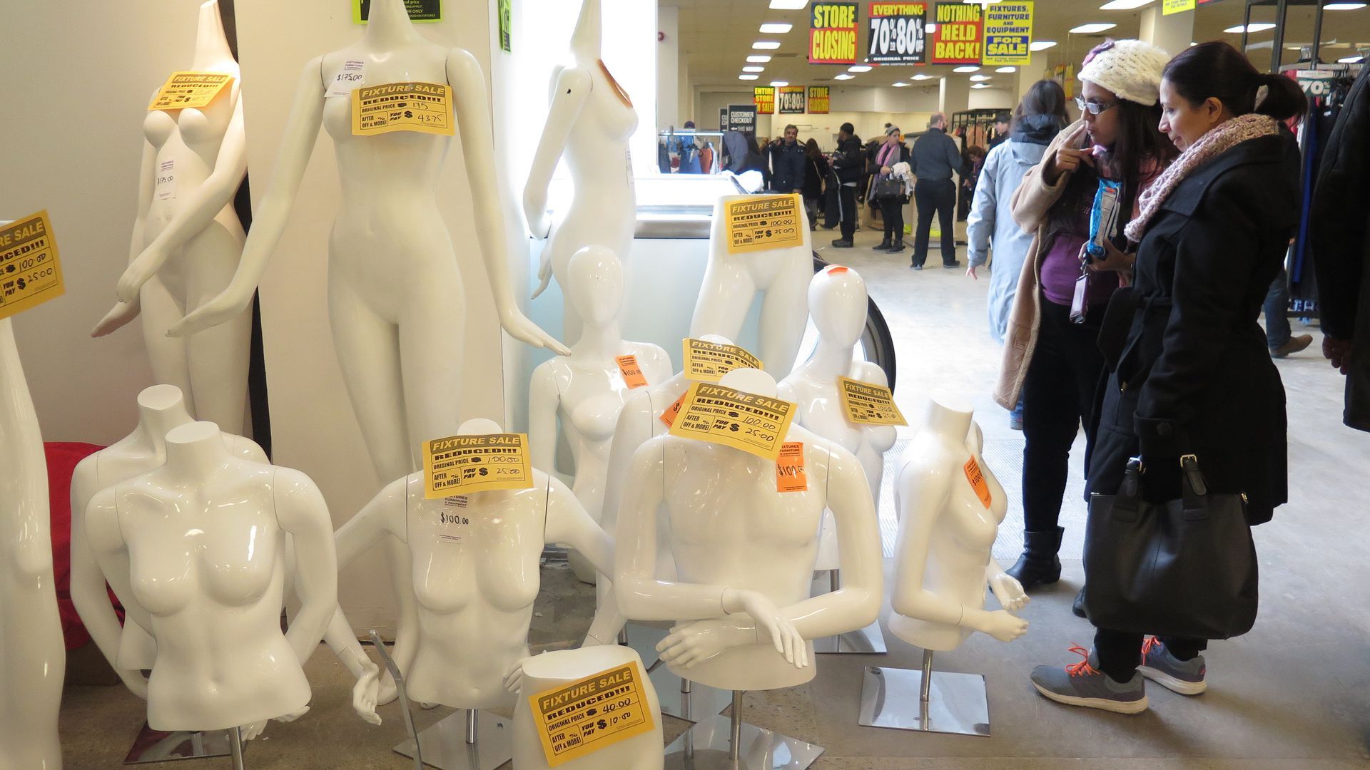 A pile of store mannequins with price tags